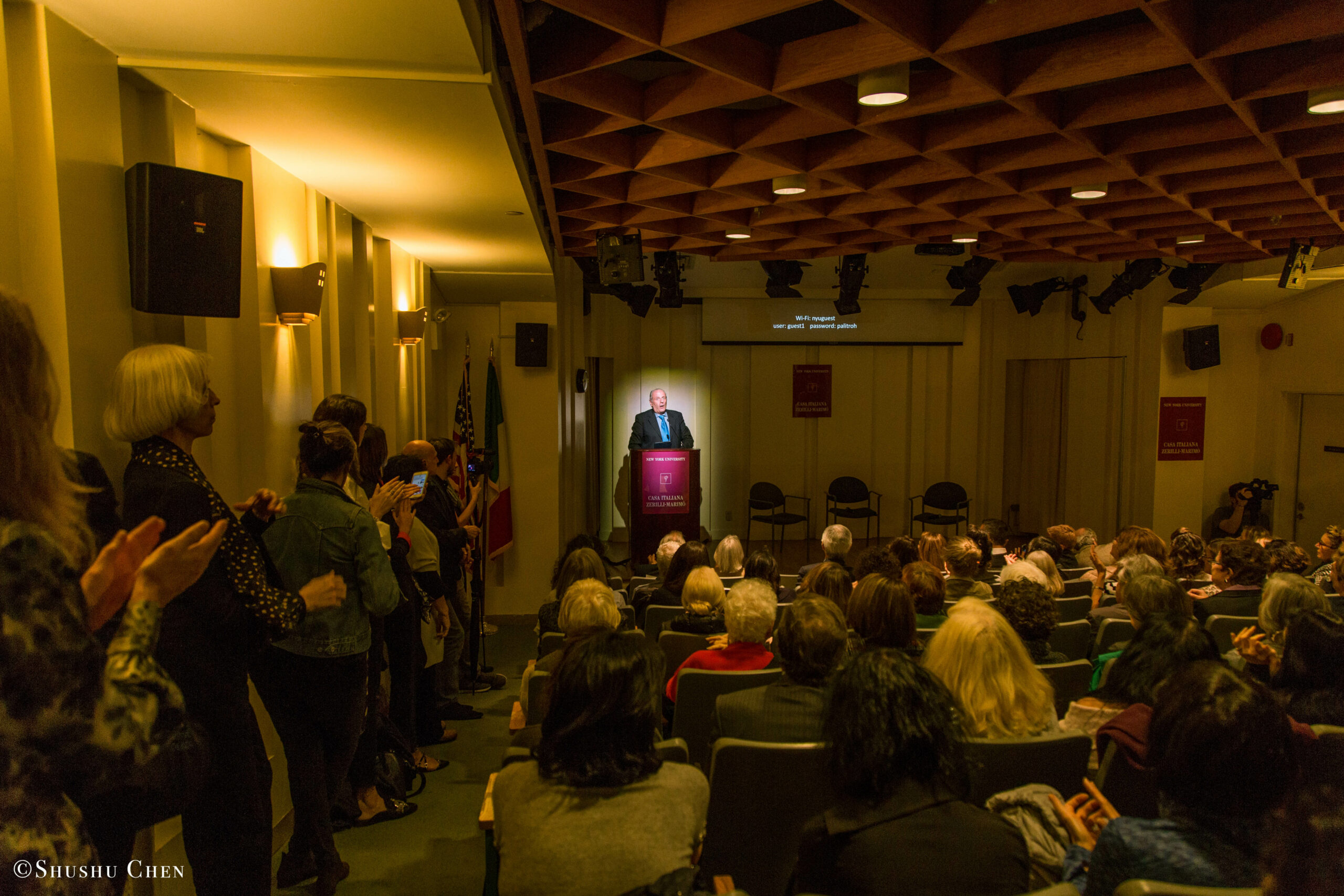 stefano-speaking-and-spectators-from-presentation-richard-gere-reads-italo-calvino-at-casa-italiana