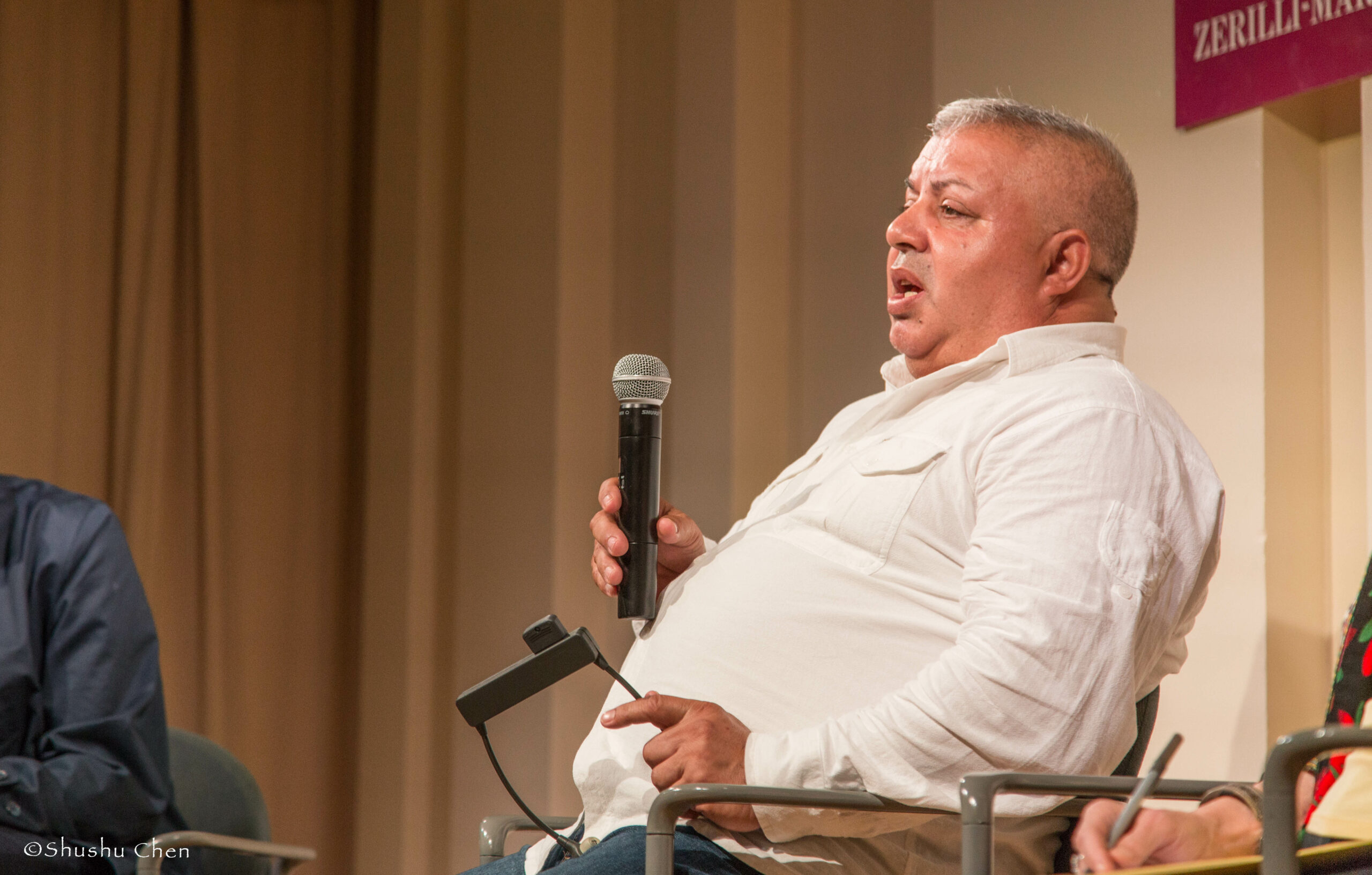 speaker-talking-from-panel-discussion-roma-migrations-at-casa-italiana