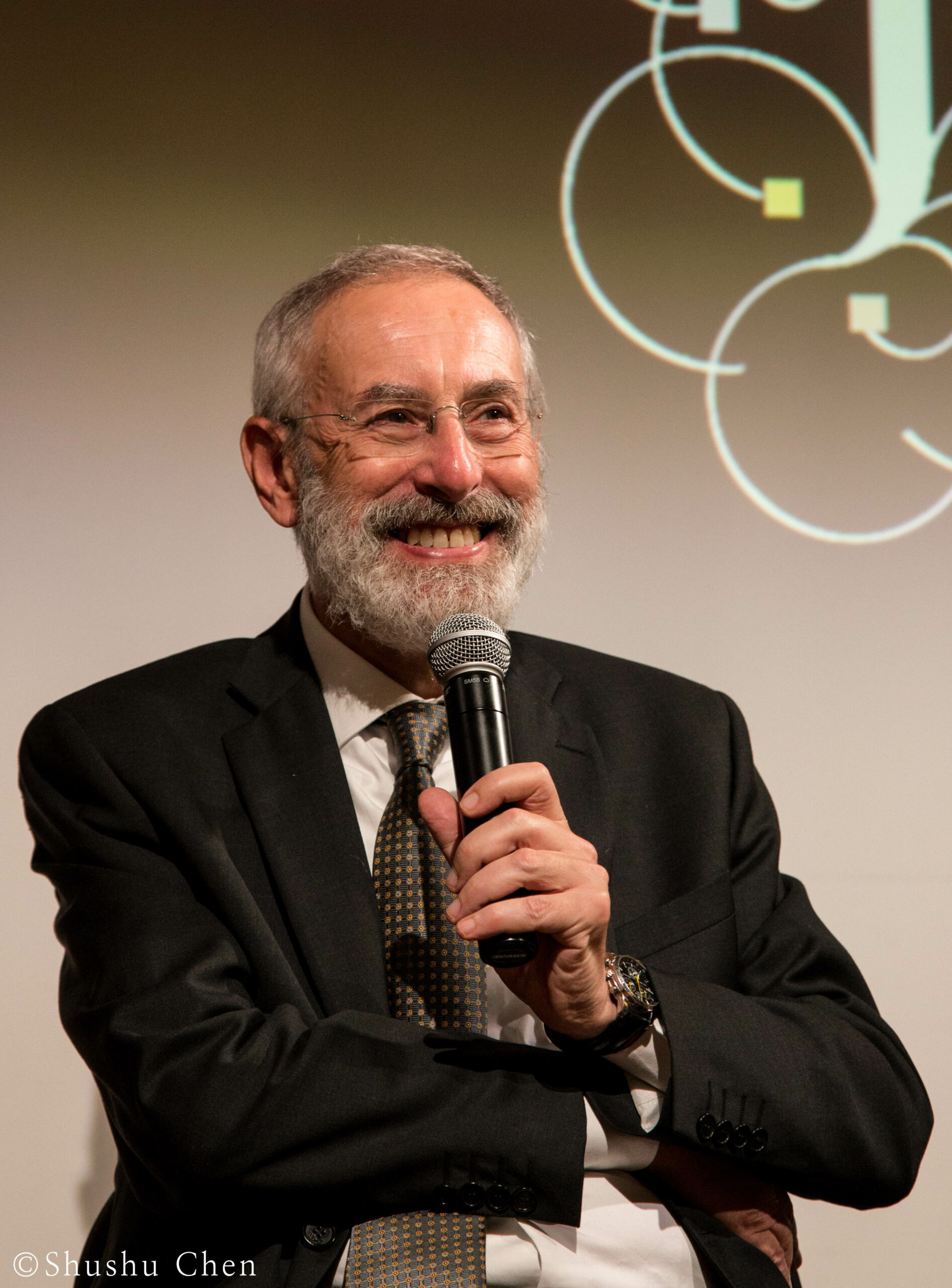 speaker-smiling-from-panel-the-babylonian-talmud-translation-project-at-casa-italiana