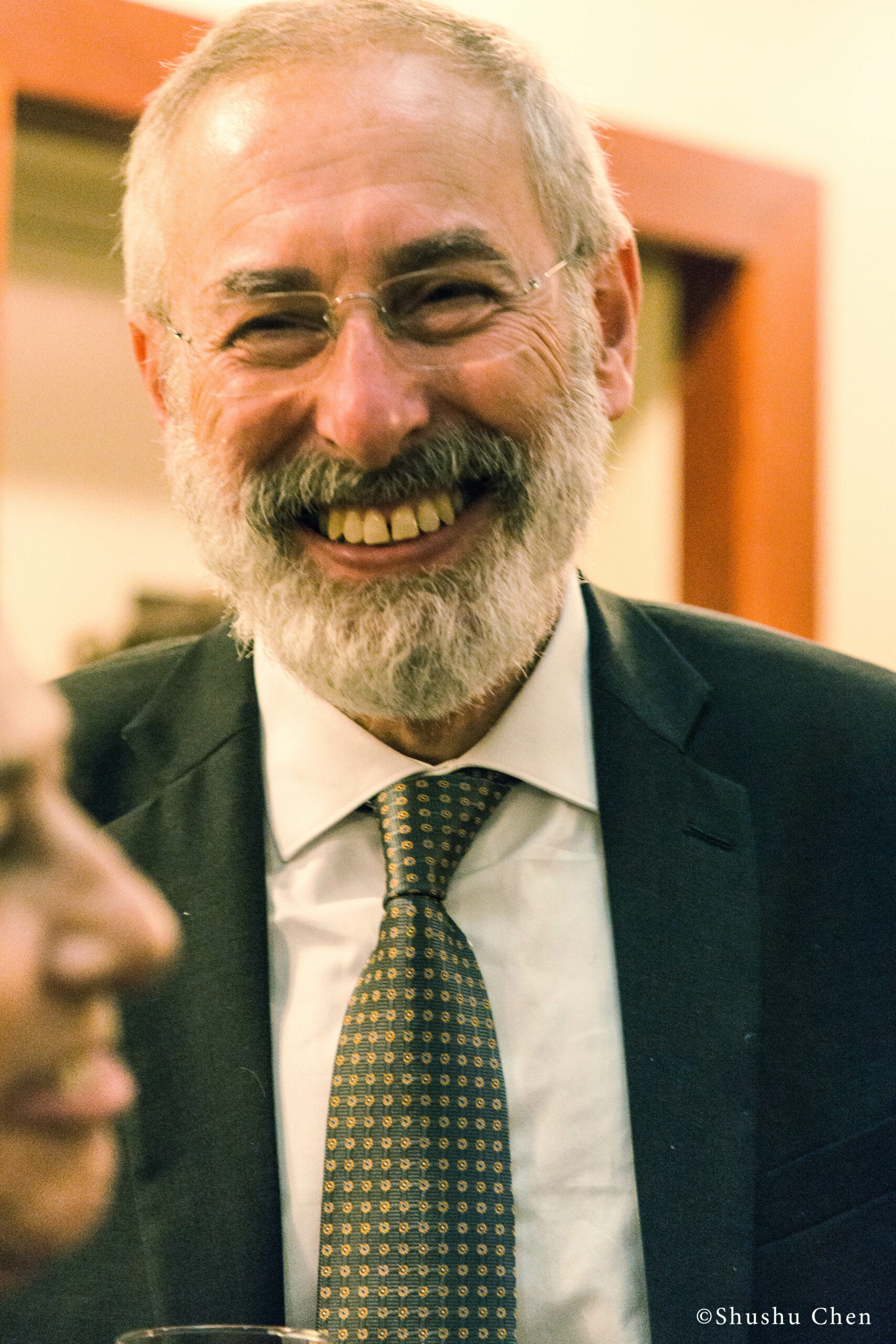 speaker-smiling-from-panel-the-babylonian-talmud-translation-project-at-casa-italiana