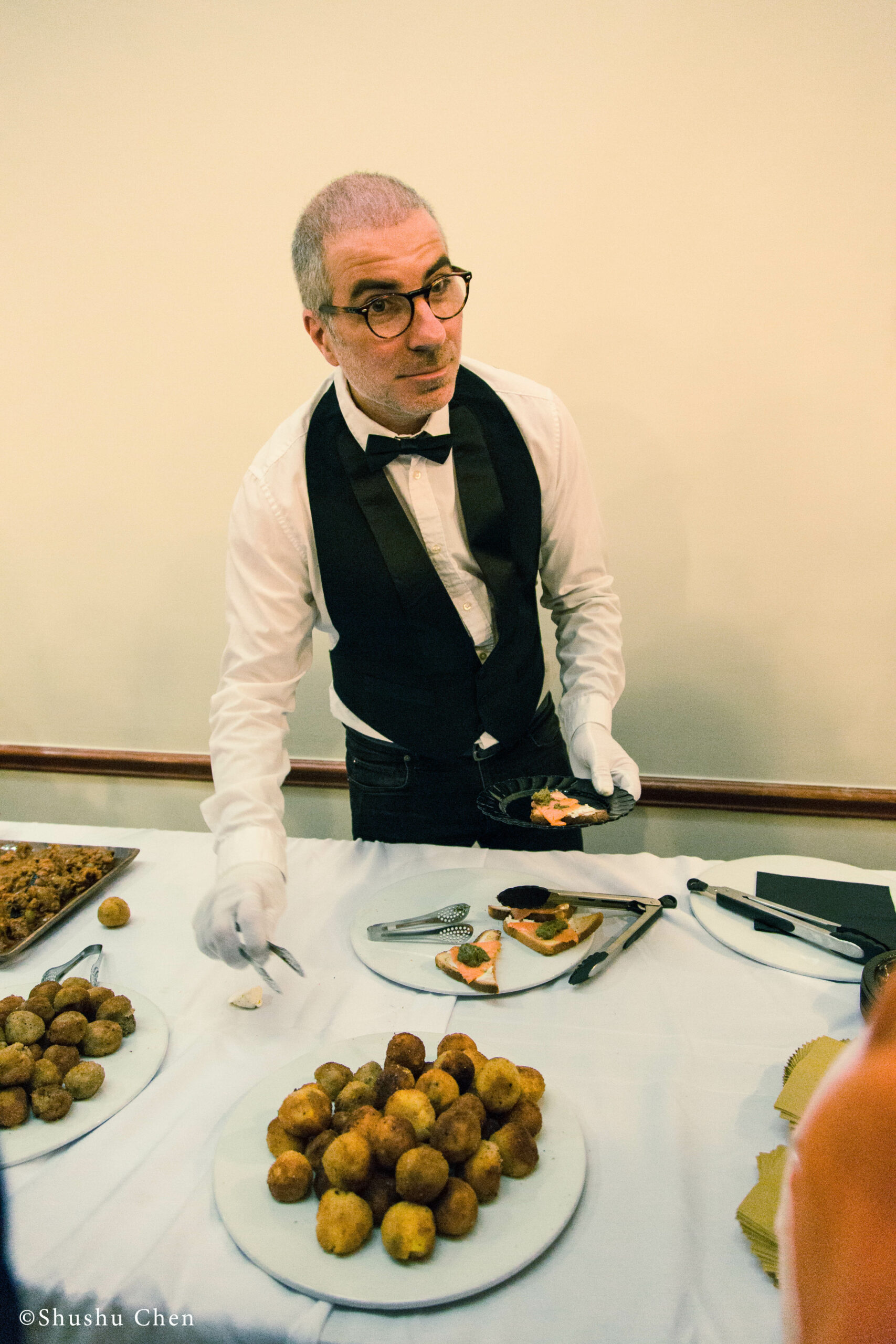 man-serving-food-from-panel-the-babylonian-talmud-translation-project-at-casa-italiana