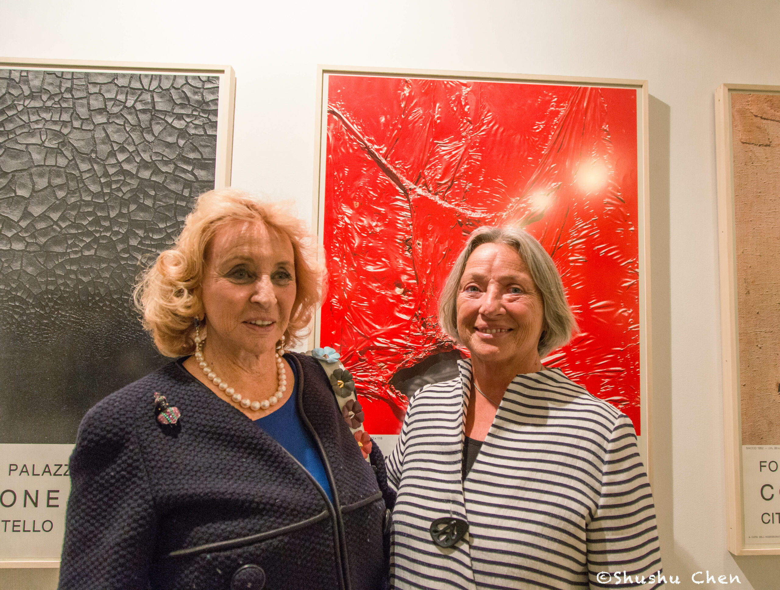 woman-smiling-from-exhibition-opening-burri-posters-at-casa-italiana