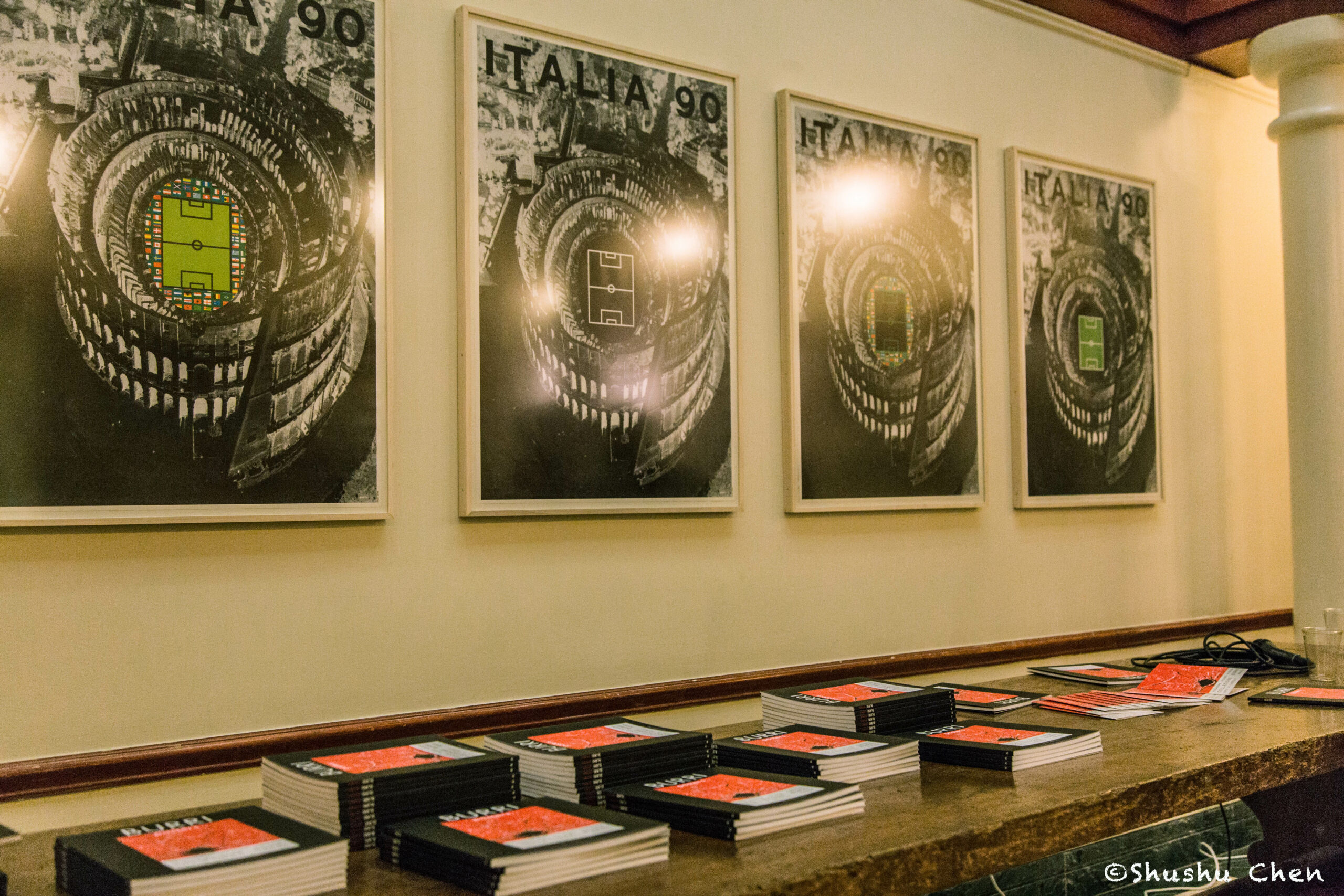 artworks-on-wall-and-books-from-exhibition-opening-burri-posters-at-casa-italiana