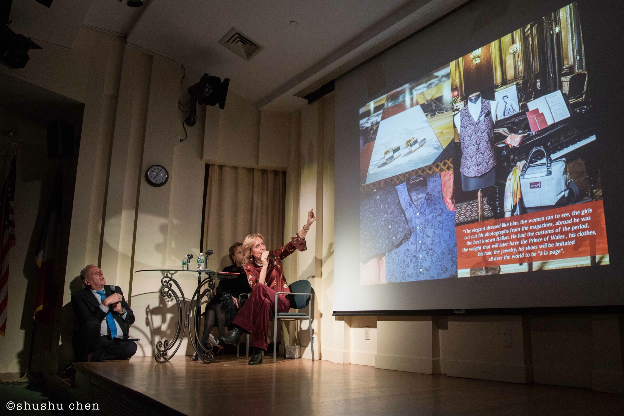 speaker-showing-image-on-projector-screen-from-addressing-style-mascagni-at-casa-italiana