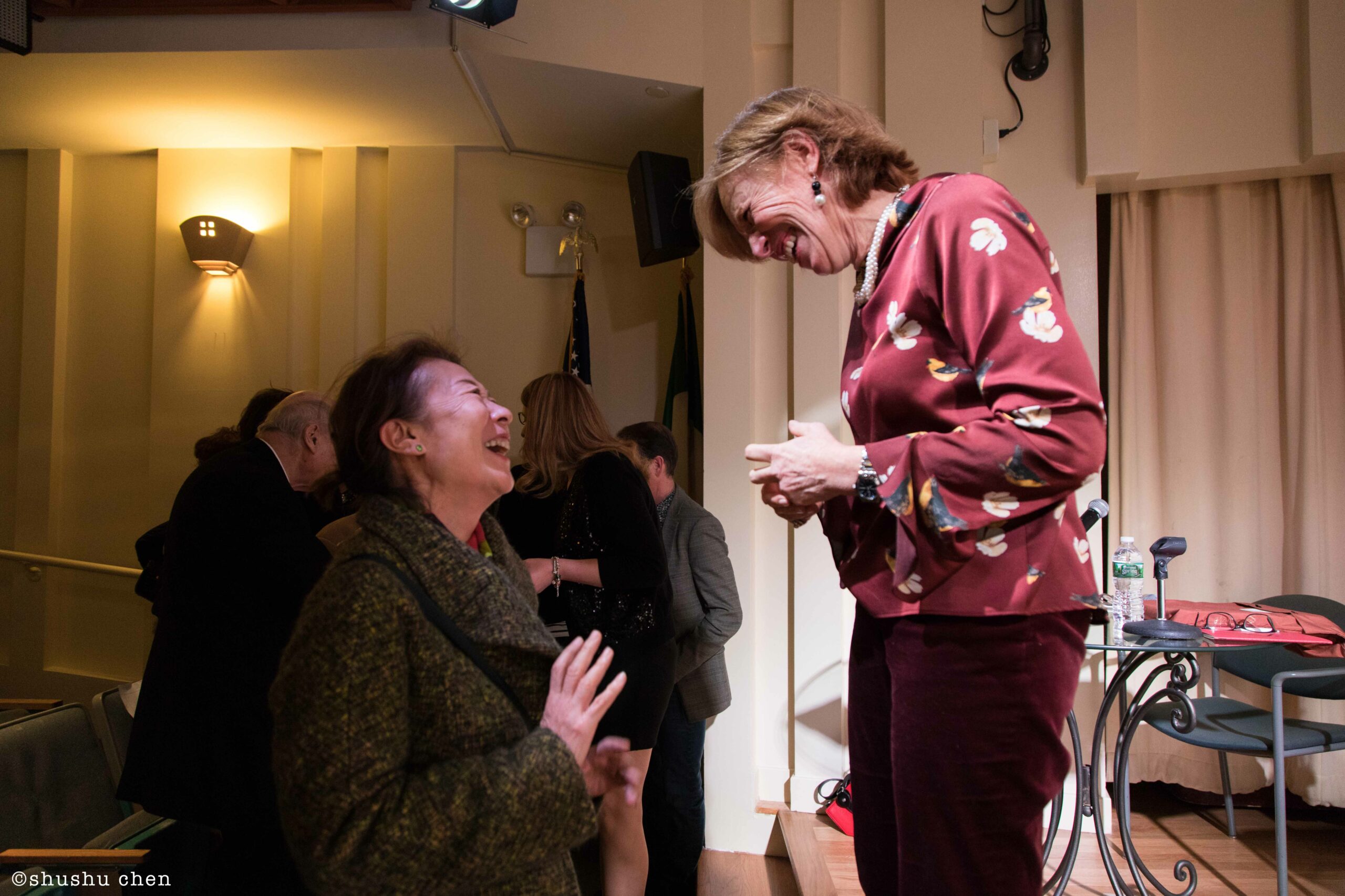 speaker-interacting-with-guests-from-addressing-style-mascagni-at-casa-italiana