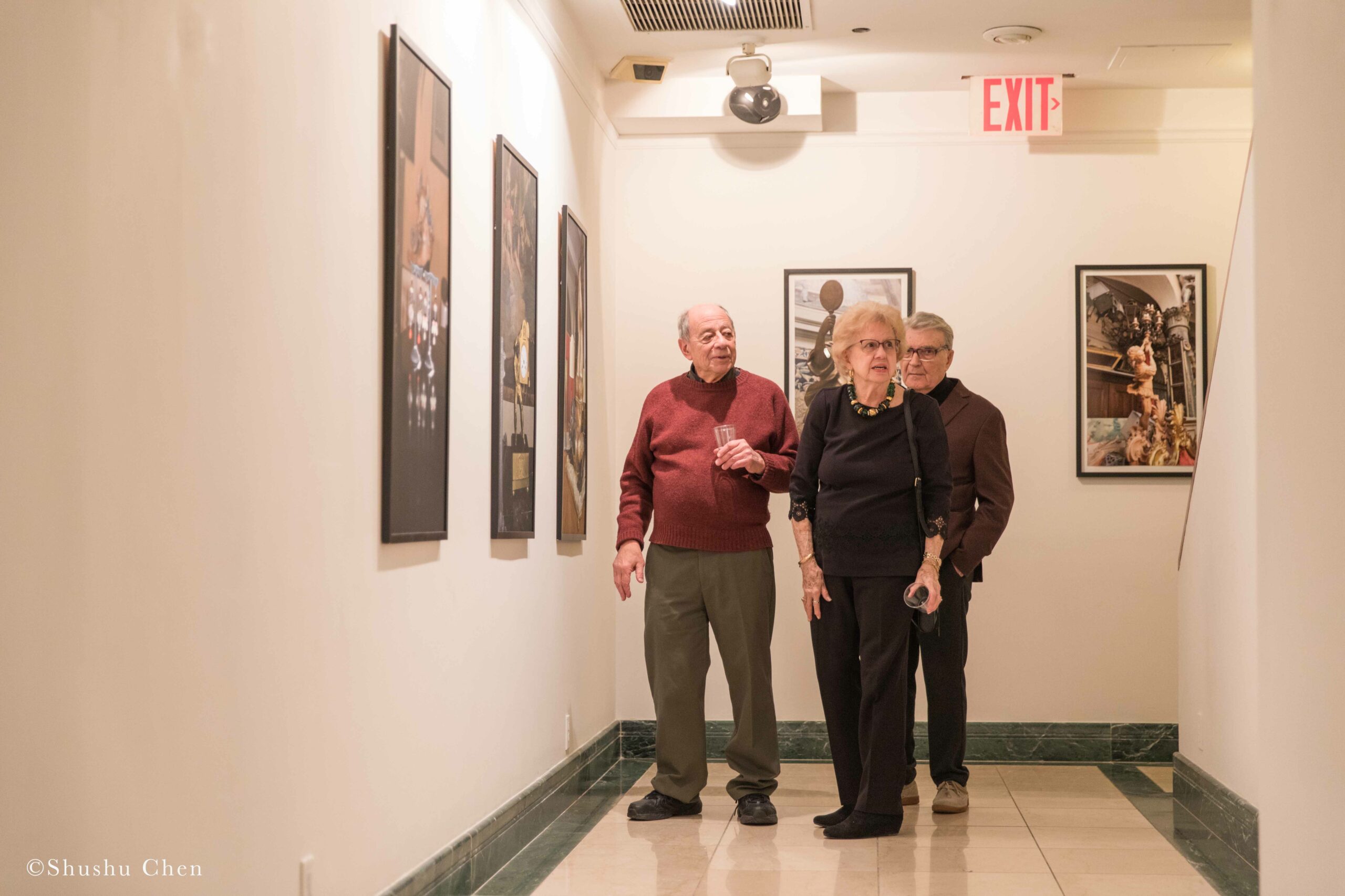people-seeing-artwork-on-wall-from-exhibition-opening-resignifications-revisited-at-casa-italiana