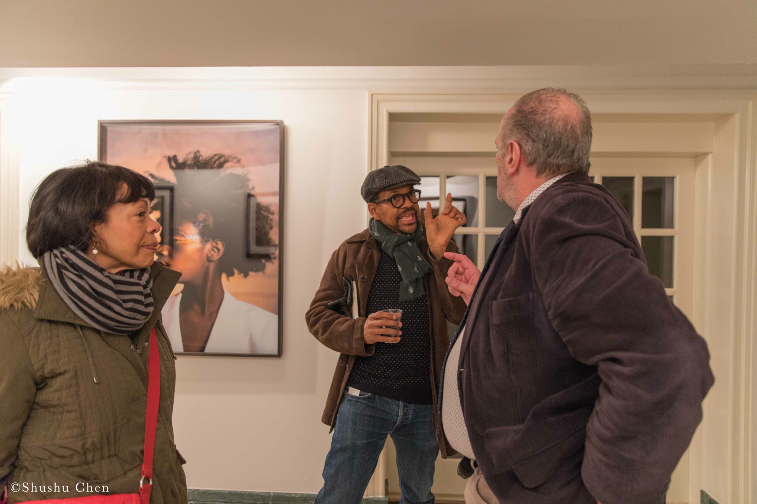 stefano-and-guests-conversing-from-exhibition-opening-resignifications-revisited-at-casa-italiana