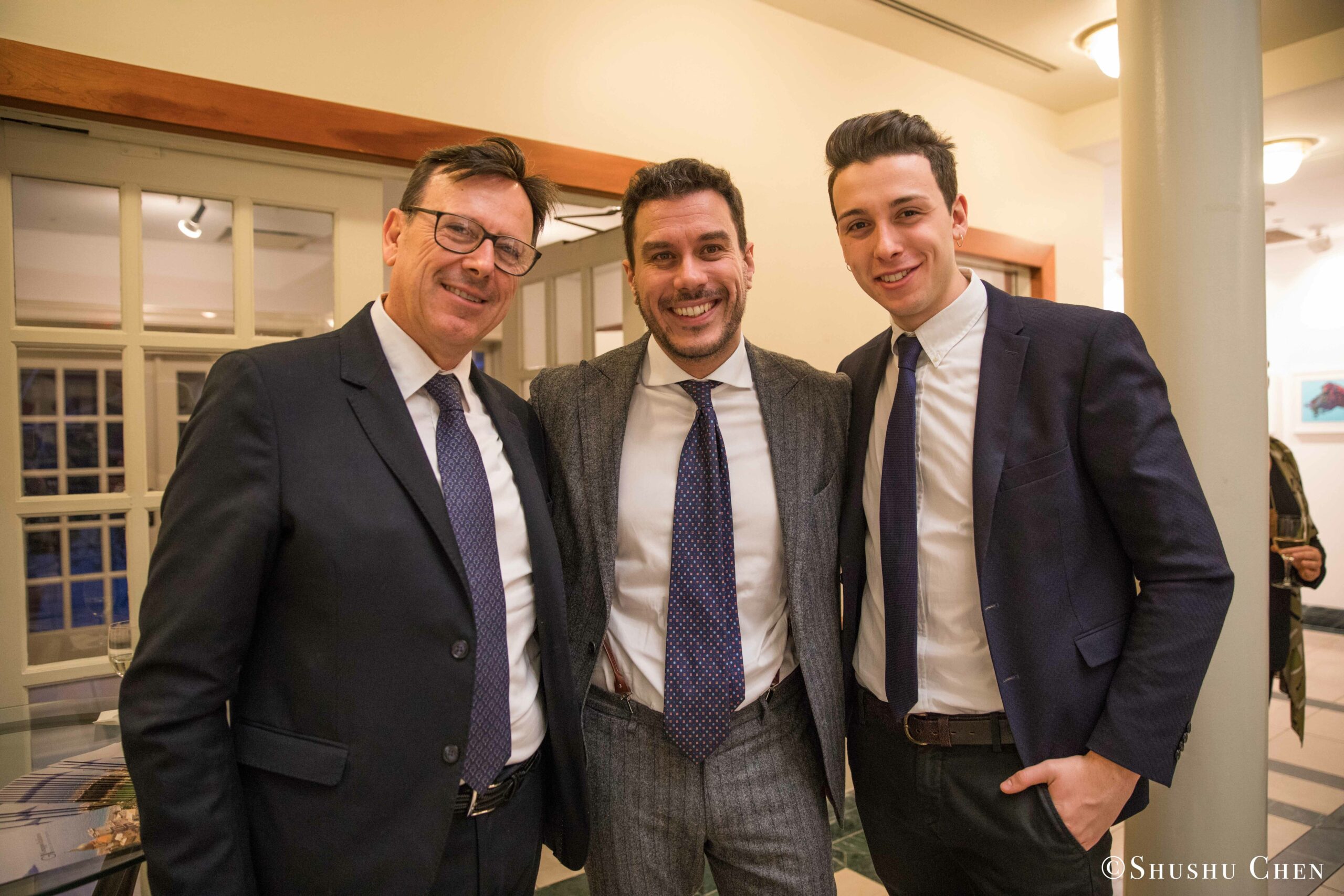 three-smiling-men-in-business-suits-from-Italian-table-talks-at-casa-italiana