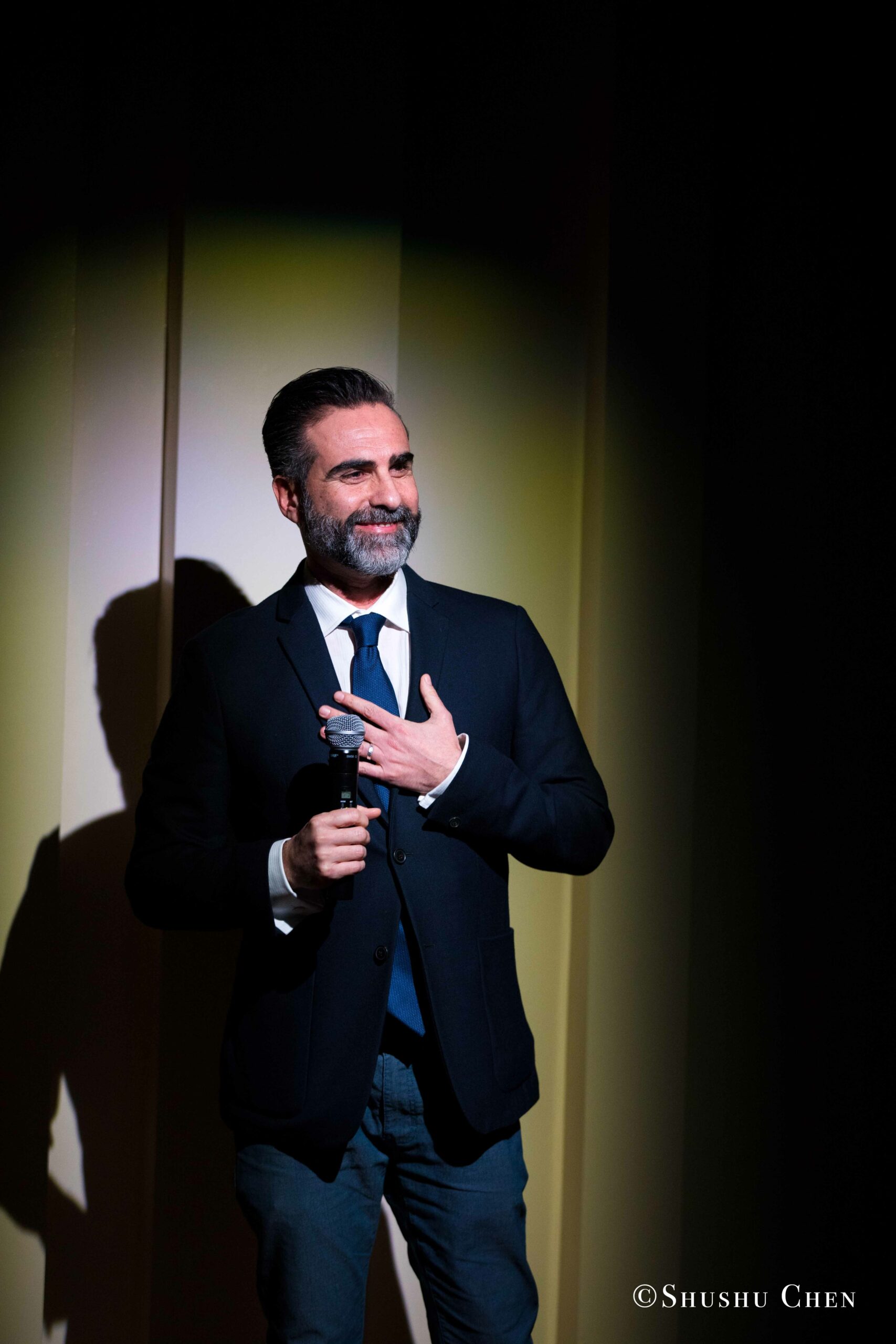 speaker-smiling-from-concert-an-evening-with-piano-music-of-roberto-scarcella-perino-at-casa-italiana