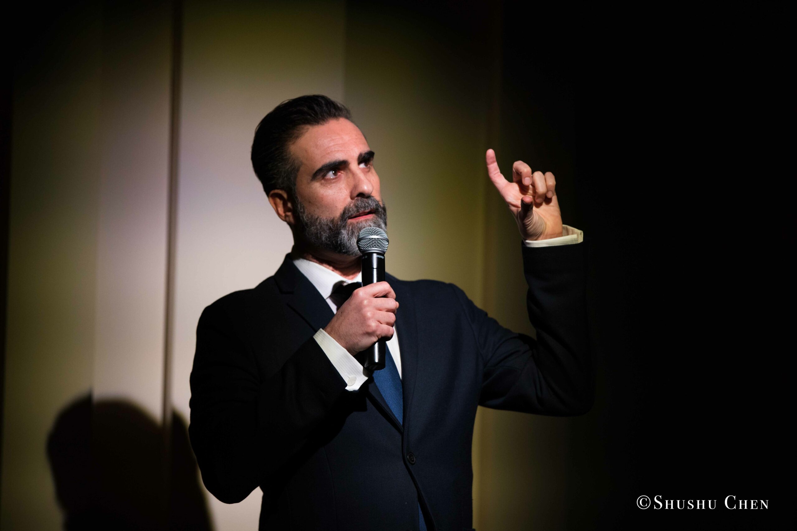 speaker-talking-from-concert-an-evening-with-piano-music-of-roberto-scarcella-perino-at-casa-italiana