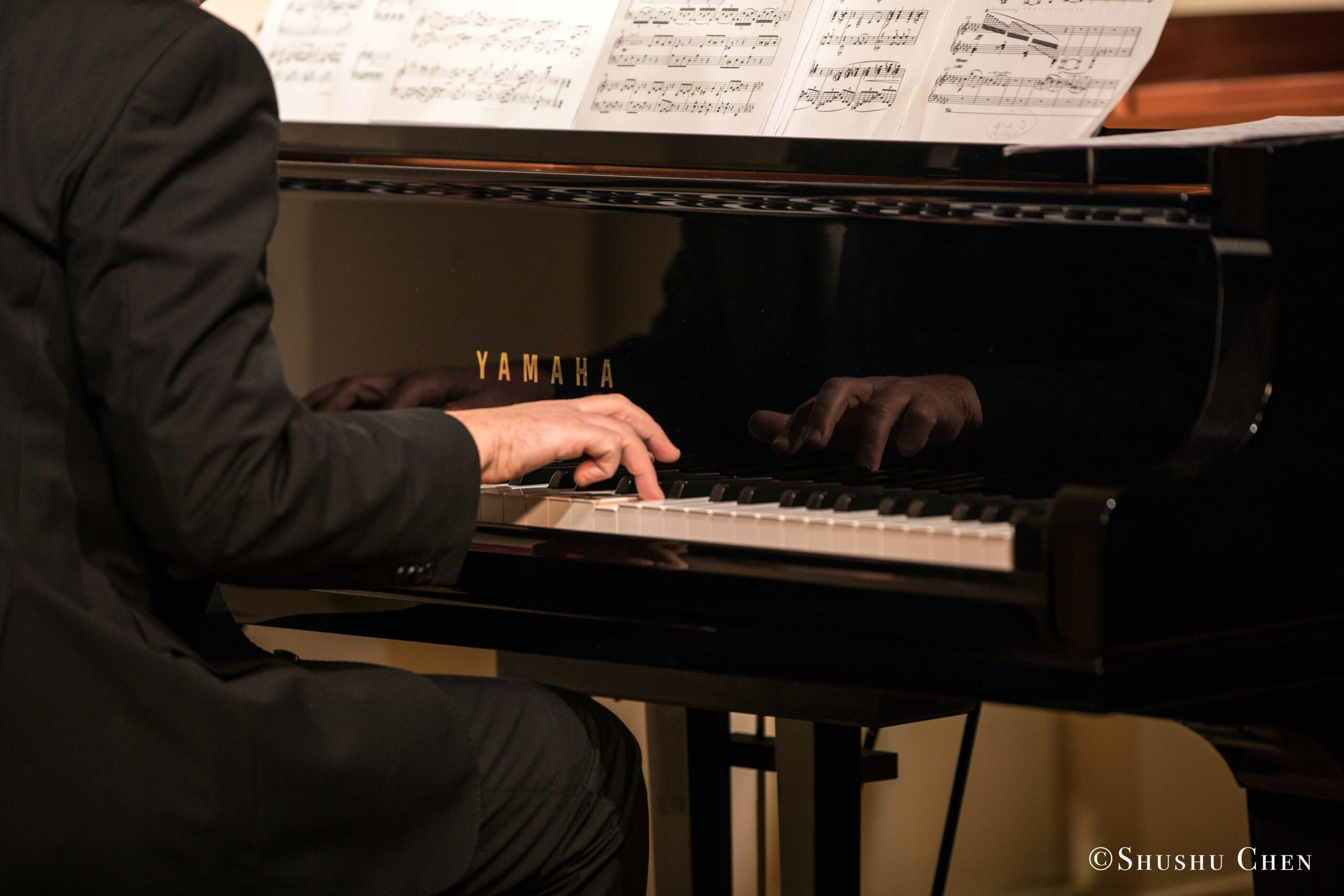 musician-playing-piano-from-concert-an-evening-with-piano-music-of-roberto-scarcella-perino-at-casa-italiana