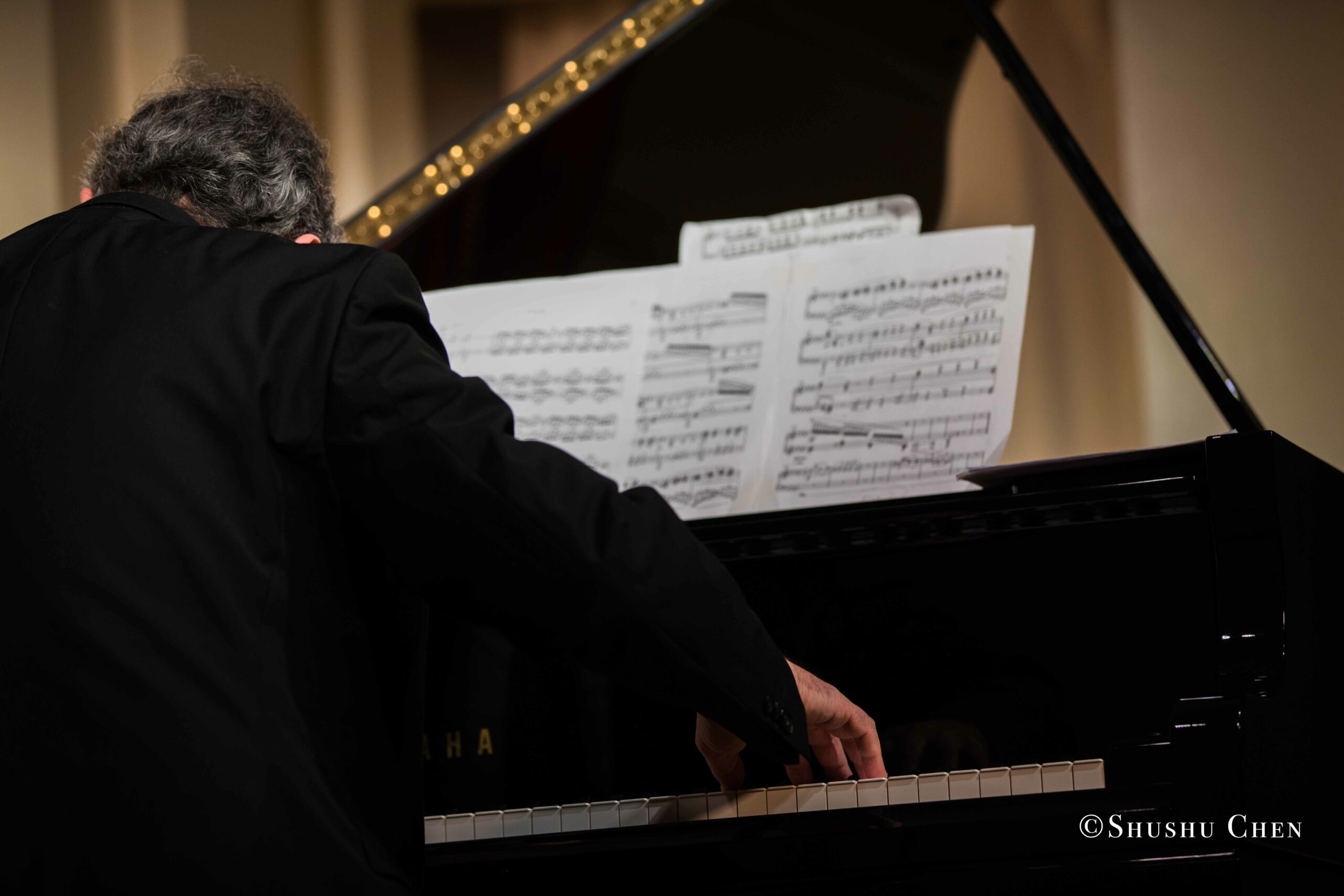 musician-playing-piano-from-concert-an-evening-with-piano-music-of-roberto-scarcella-perino-at-casa-italiana