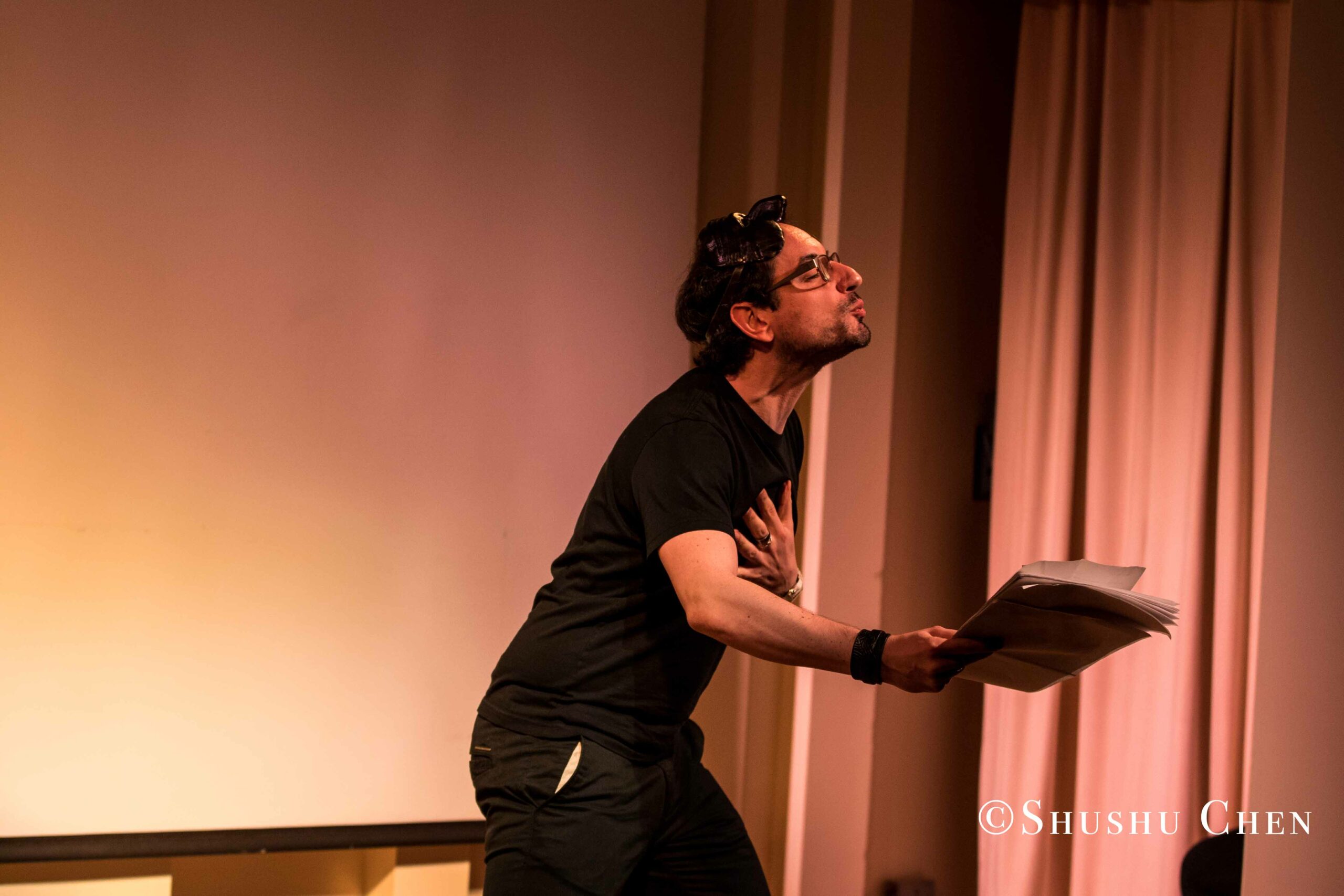 artist-performing-from-on-the-italian-stage-comedy-at-casa-italiana