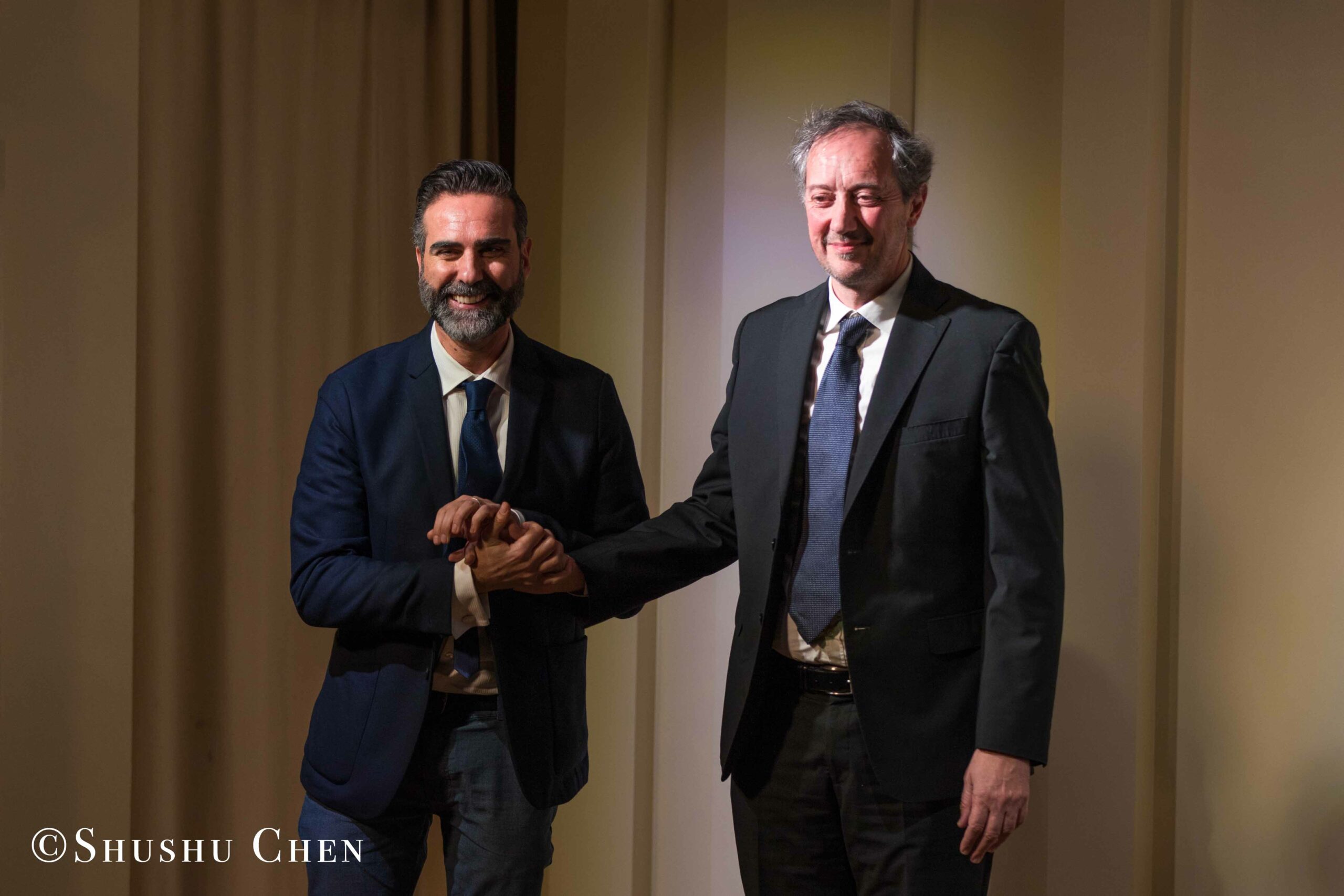 speaker-and-artist-smiling-from-concert-an-evening-with-piano-music-of-roberto-scarcella-perino-at-casa-italiana