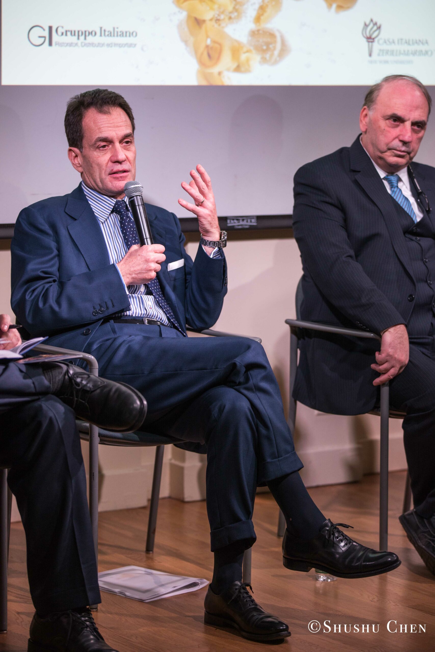 two-men-seated-in-a-discussion-from-Italian-table-talks-at-casa-italiana