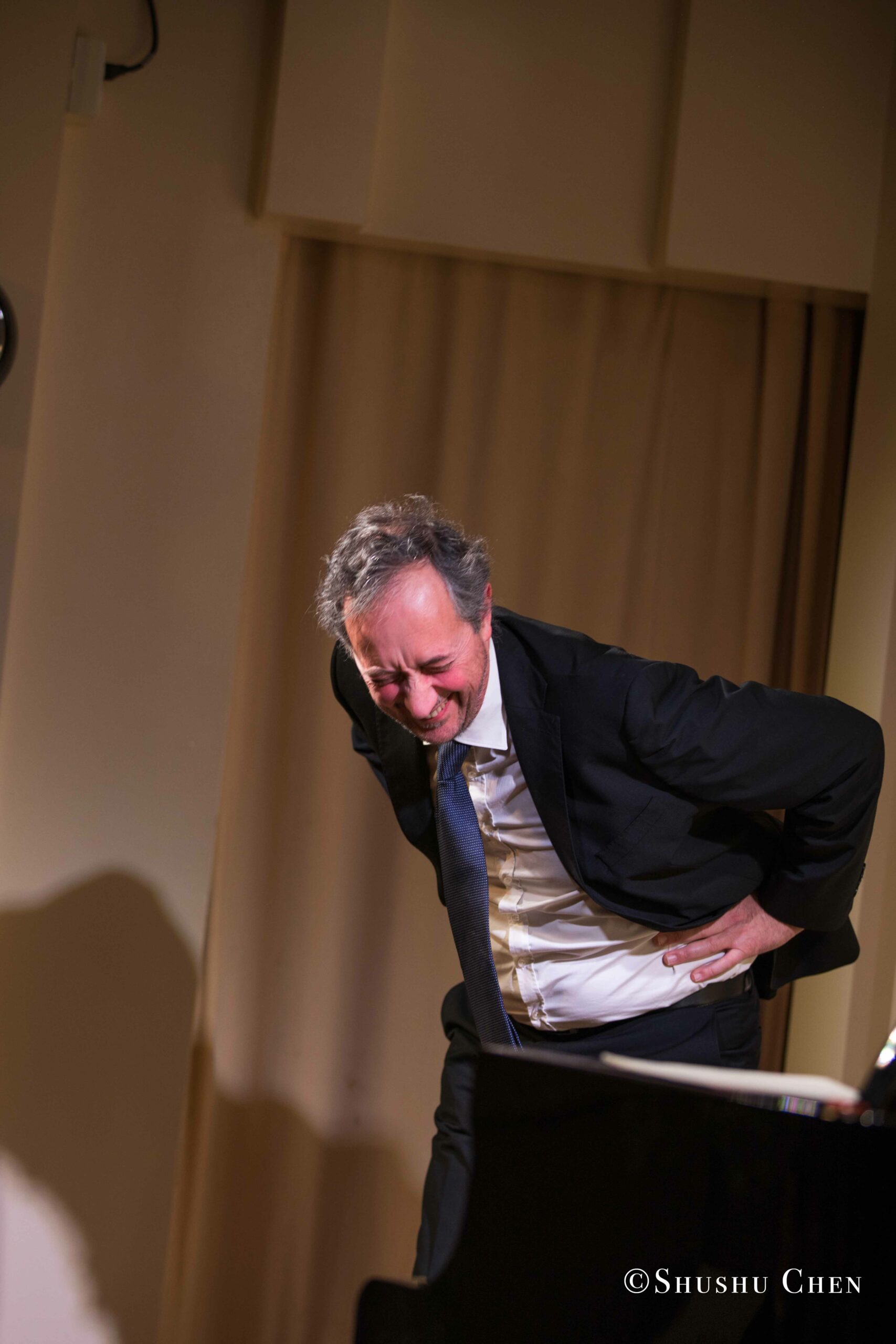 artist-smiling-from-concert-an-evening-with-piano-music-of-roberto-scarcella-perino-at-casa-italiana