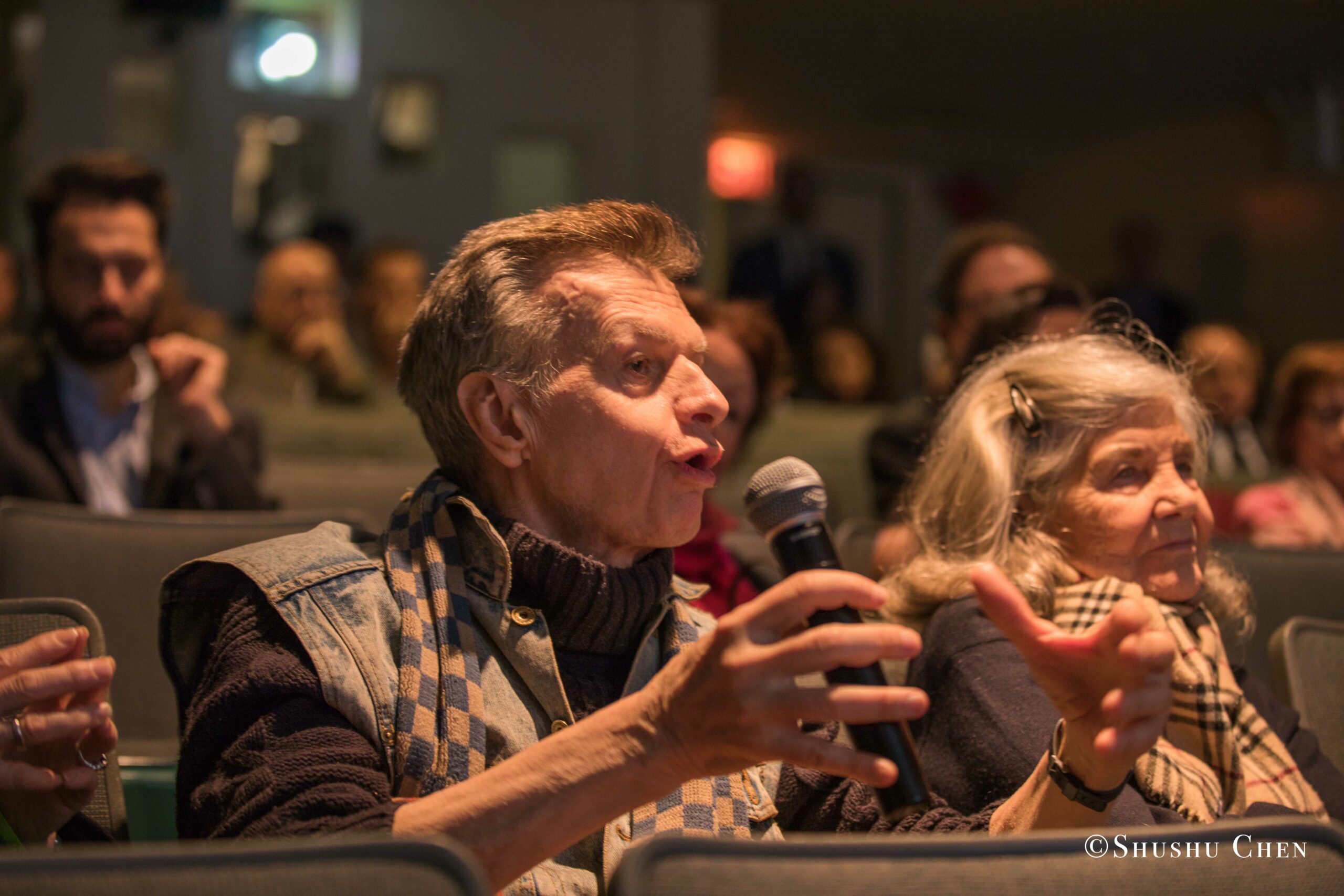 an-elderly-man-passionately-asking-a-question-from-Italian-table-talks-at-casa-italiana