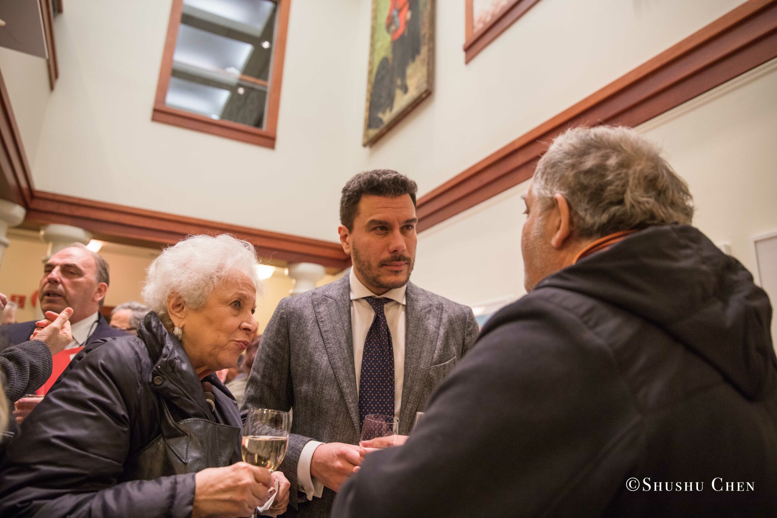 three-elderly-adults-engaged-in-a-conversation-from-Italian-table-talks-at-casa-italiana