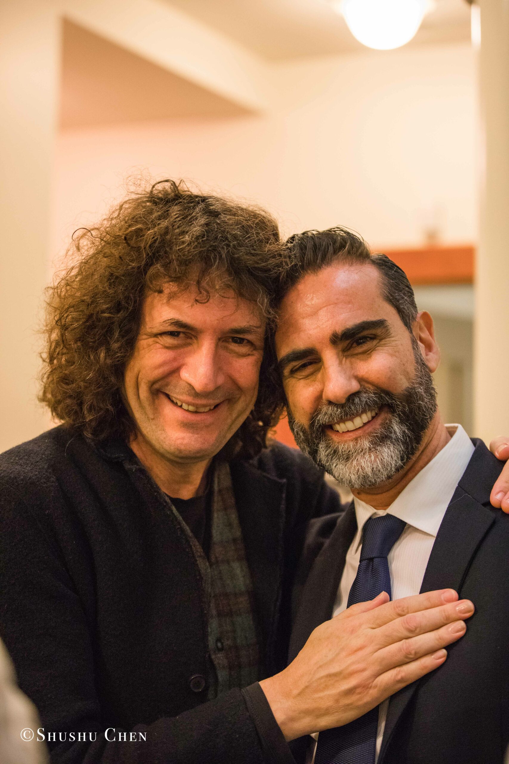 artist-with-speaker-smiling-from-concert-an-evening-with-piano-music-of-roberto-scarcella-perino-at-casa-italiana