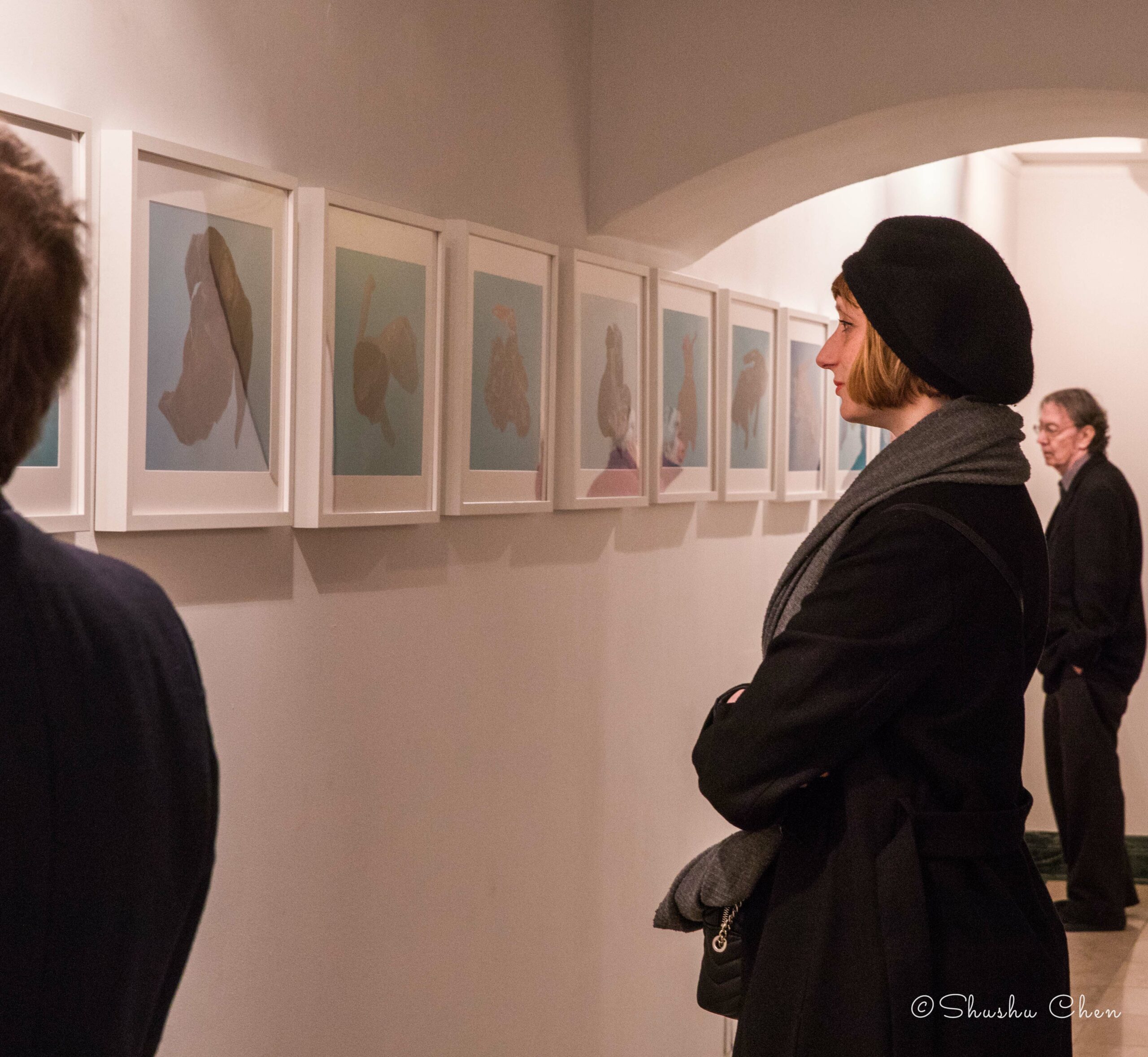people-seeing-artwork-on-wall-from-exhibition-migration-at-casa-italiana