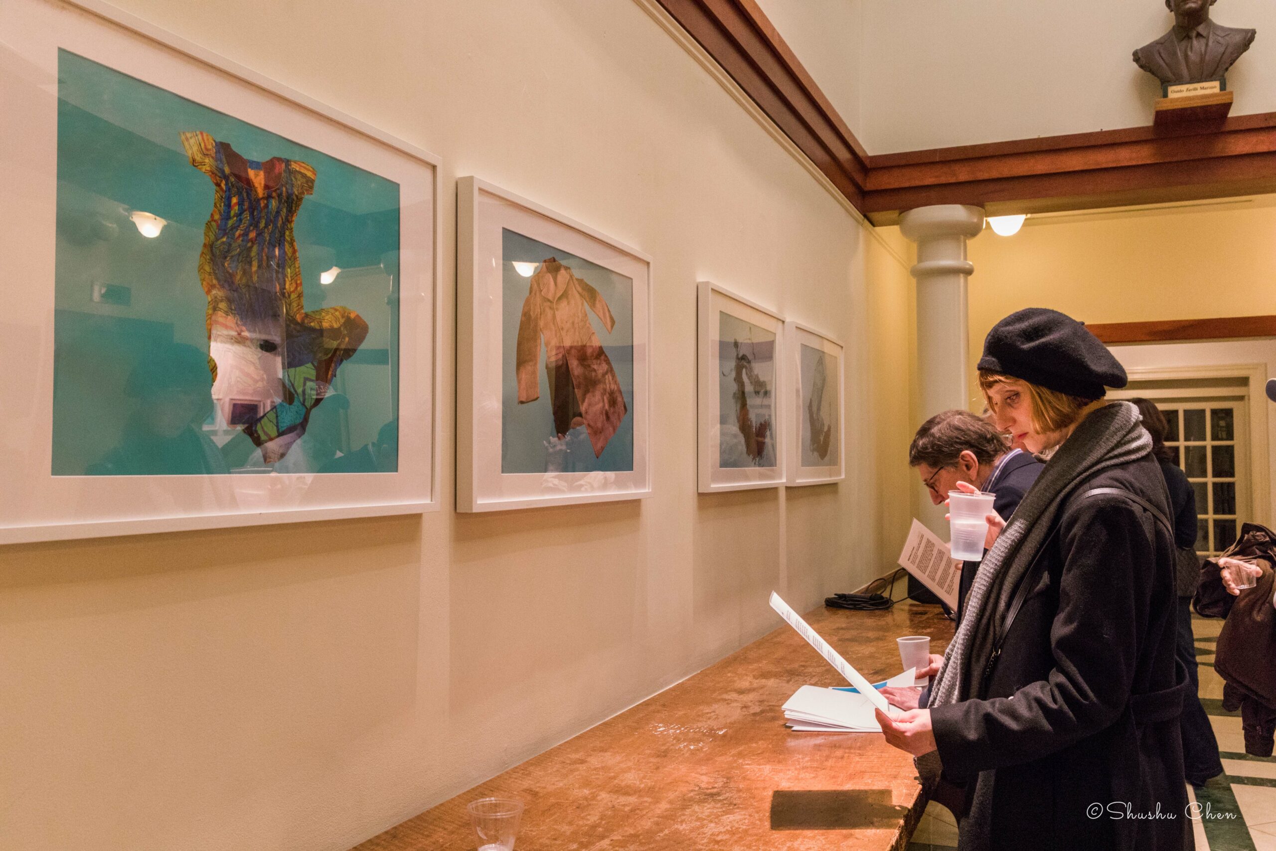 guests-reading-flyer-from-exhibition-migration-at-casa-italiana