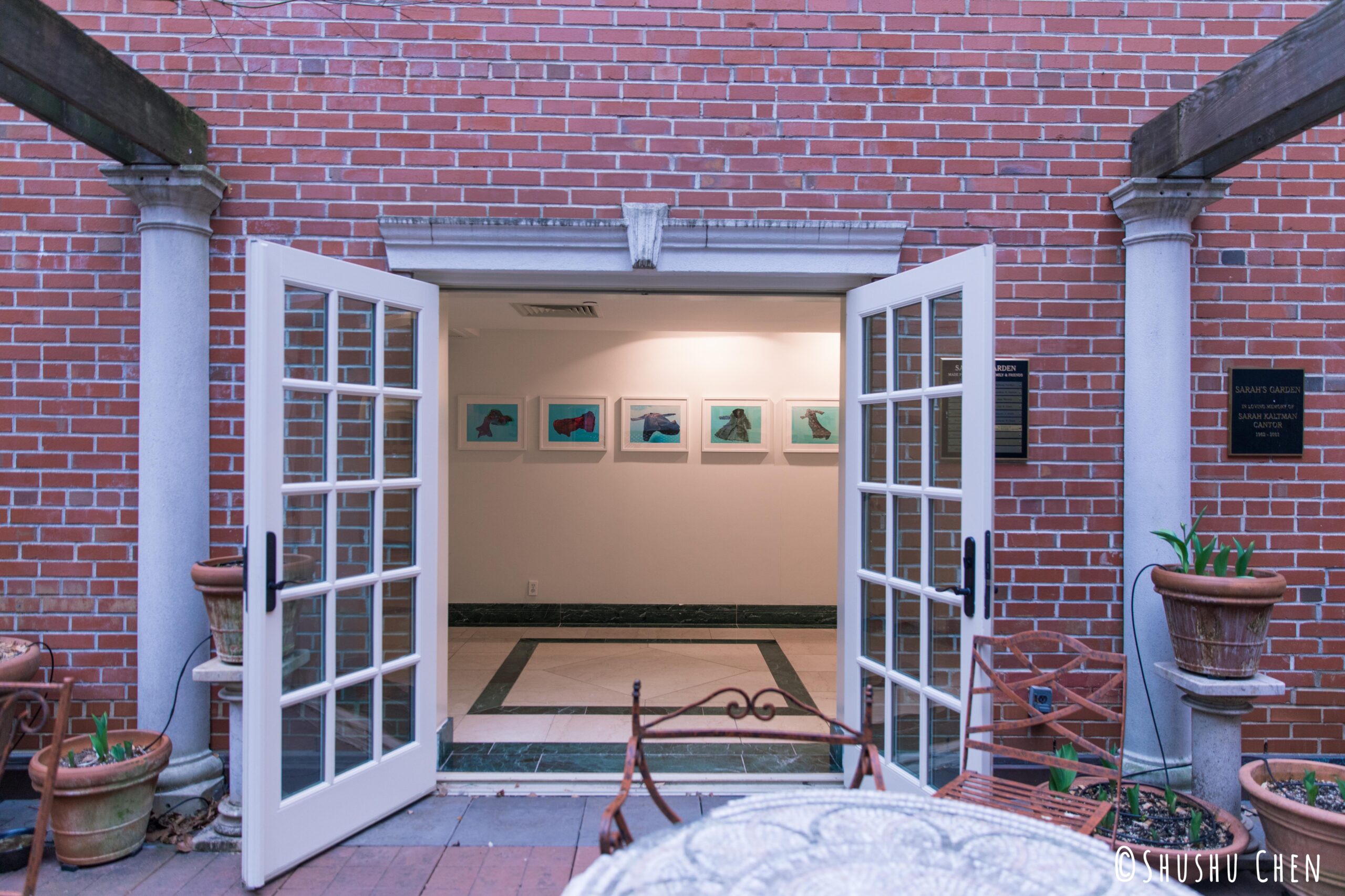 hallway-entrance-and-artworks-on-the-wall-from-exhibition-migration-at-casa-italiana