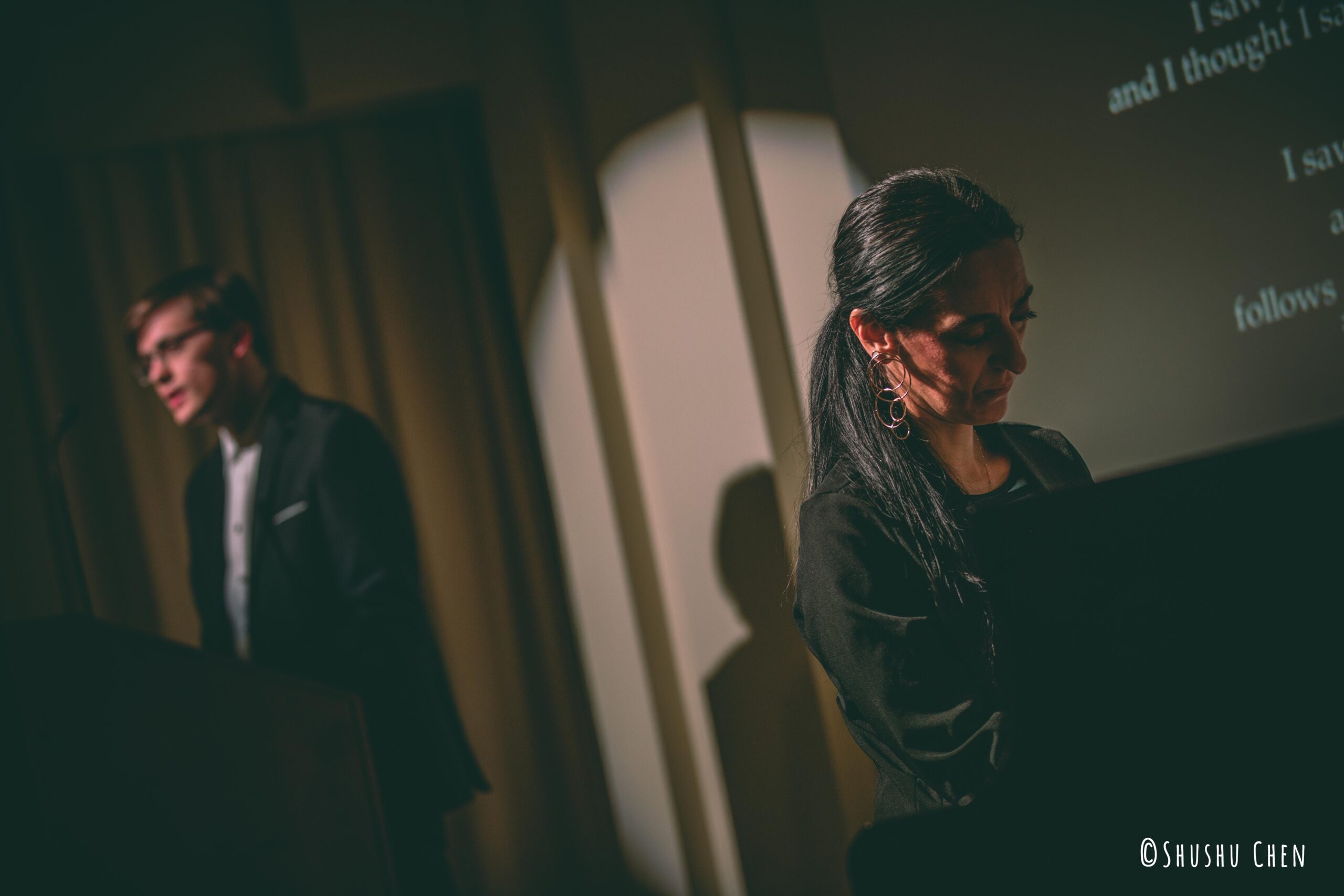 speaker-talking-and-musician-playing-piano-from-reading-performance-autumn-poetry-at-casa-italiana