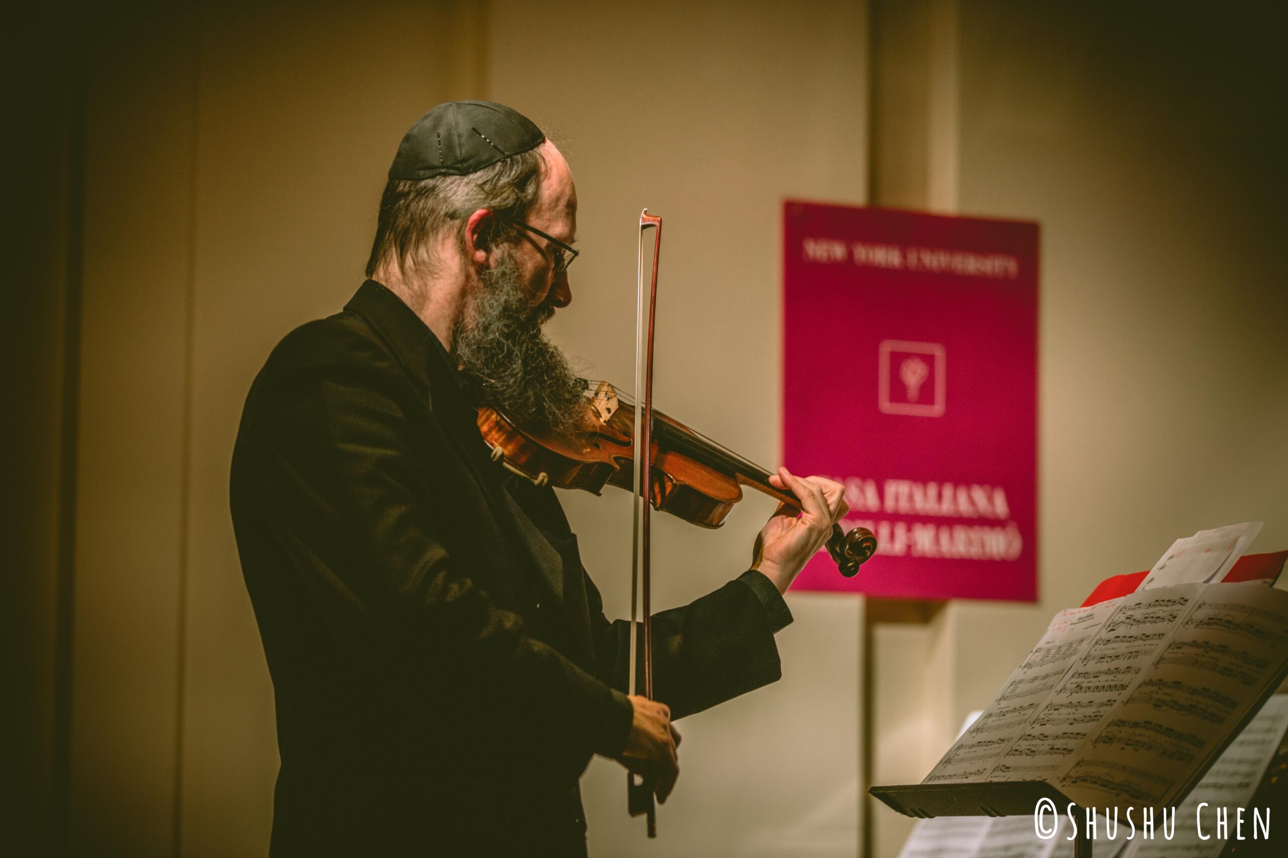 musician-playing-violin-from-concert-amen-amin-aman-at-casa-italiana