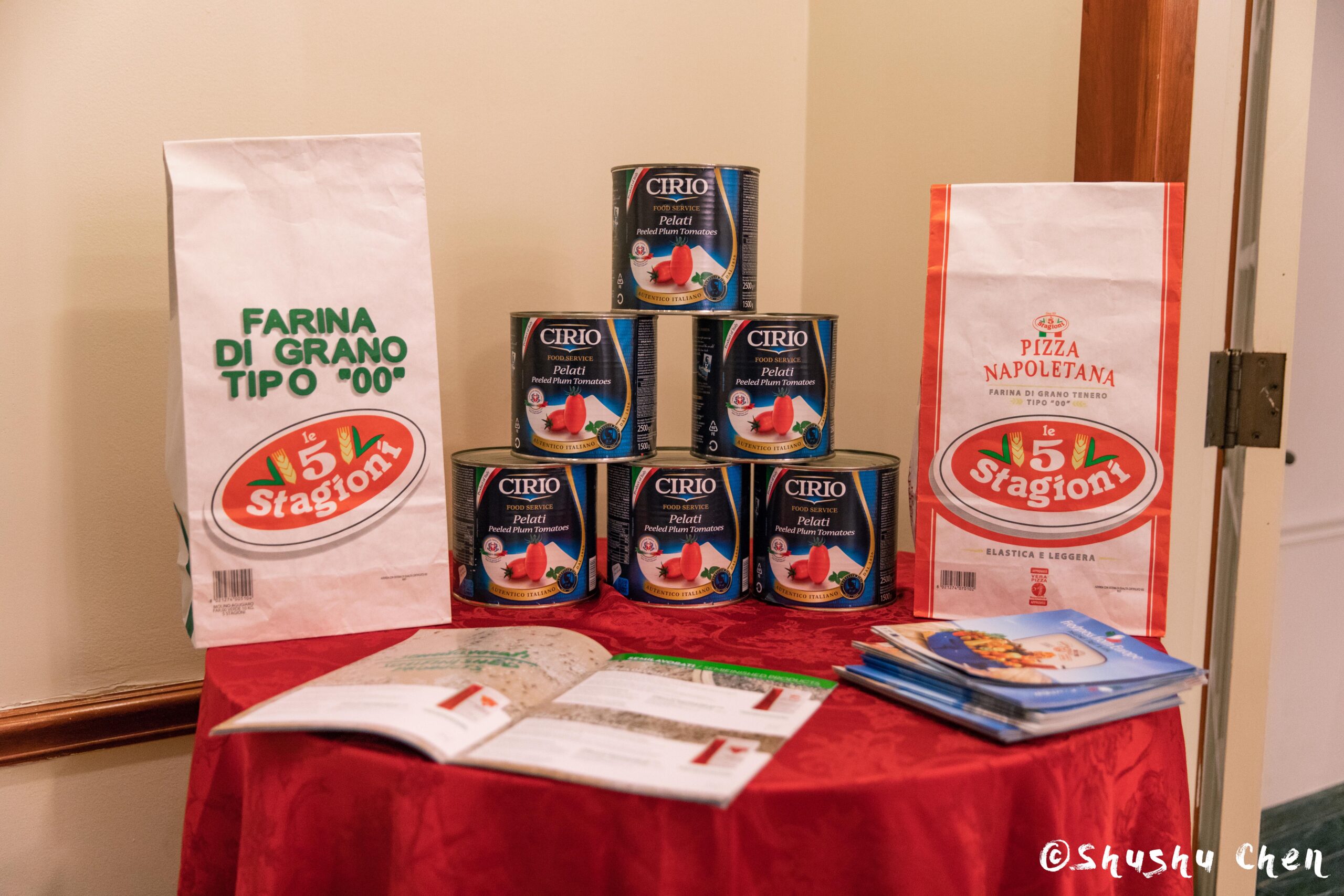 food-cans-and-bags-along-with-book-from-ny-premiere-screening-of-arrangiarsi-and-presentation-at-casa-italiana