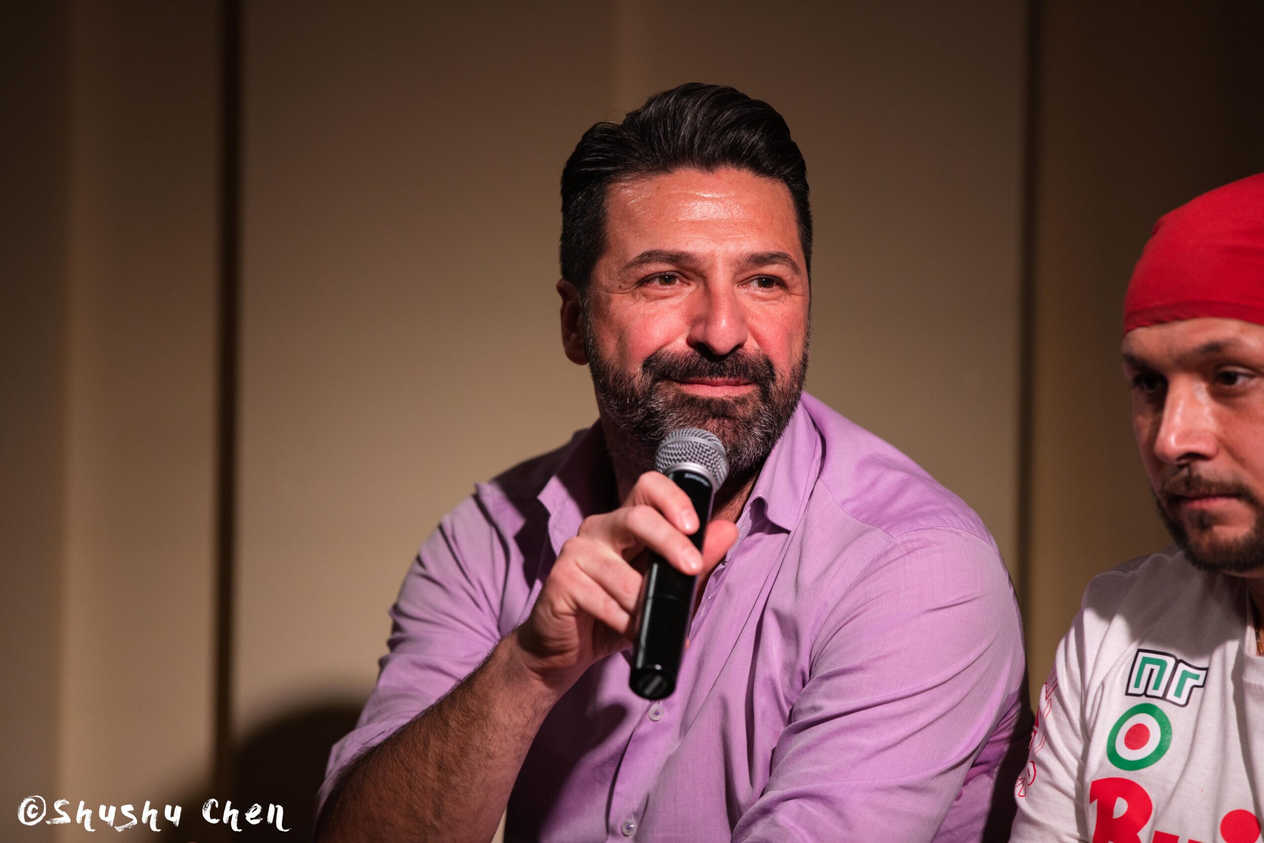 speaker-smiling-from-ny-premiere-screening-of-arrangiarsi-and-presentation-at-casa-italiana