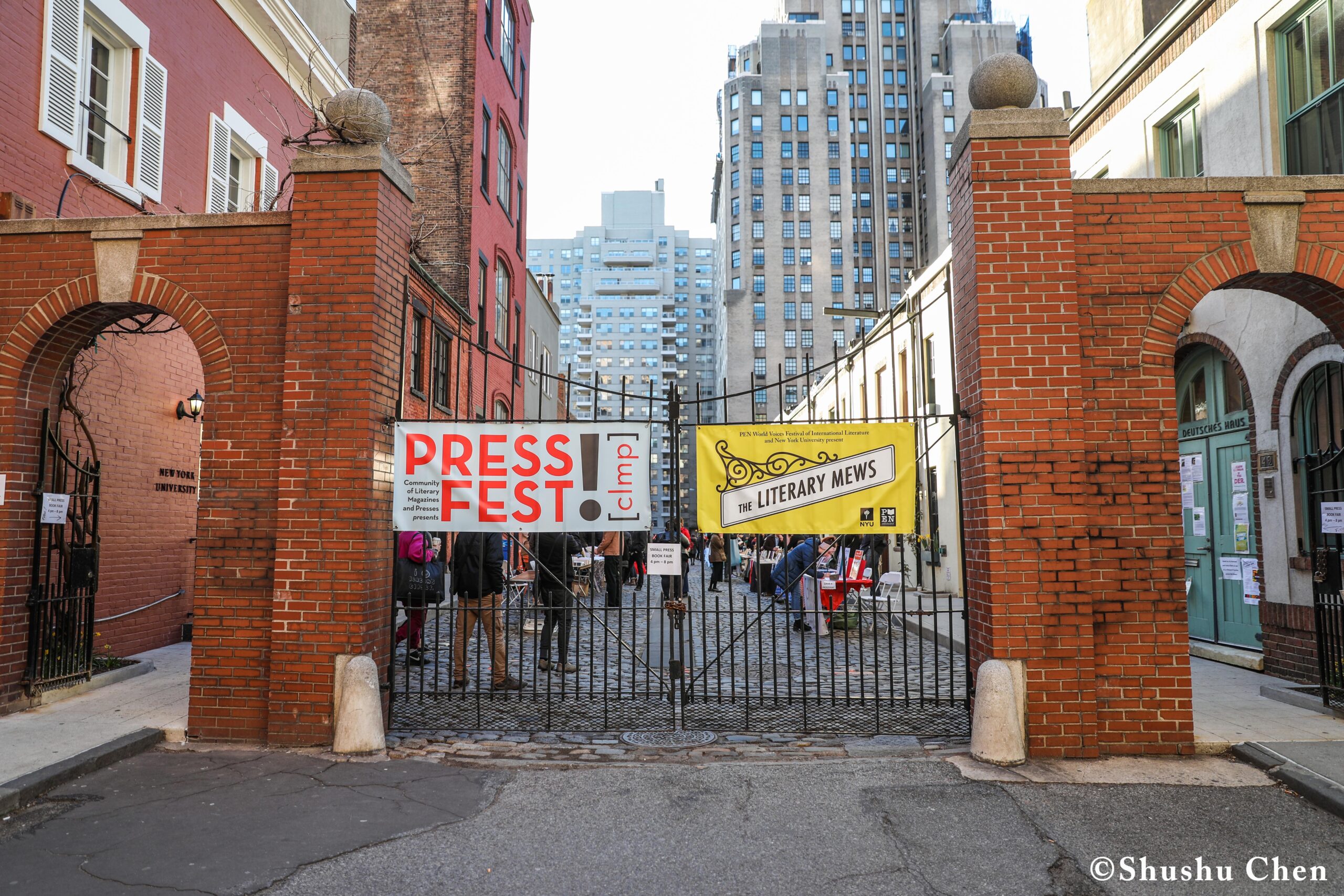 gate-with-posters-from-pen-world-voices-literary-mews-at-nyu