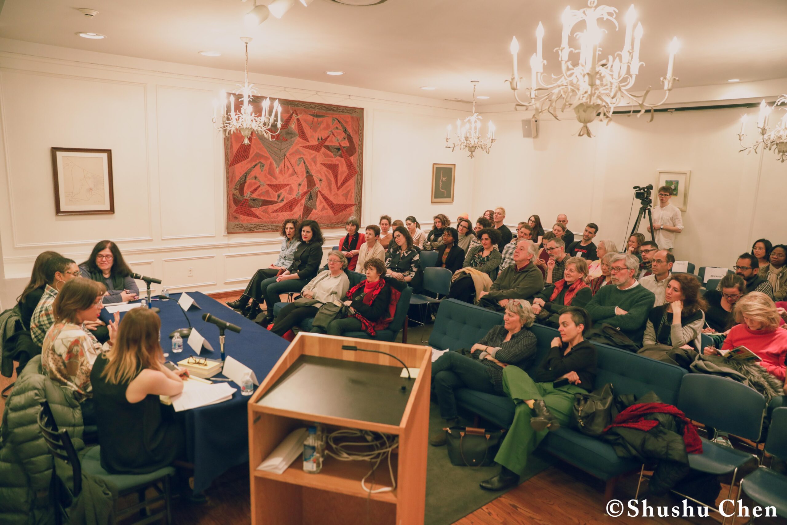 speaker-talking-and-spectators-from-pen-world-voices-literary-mews-blurring-borders-at-nyu