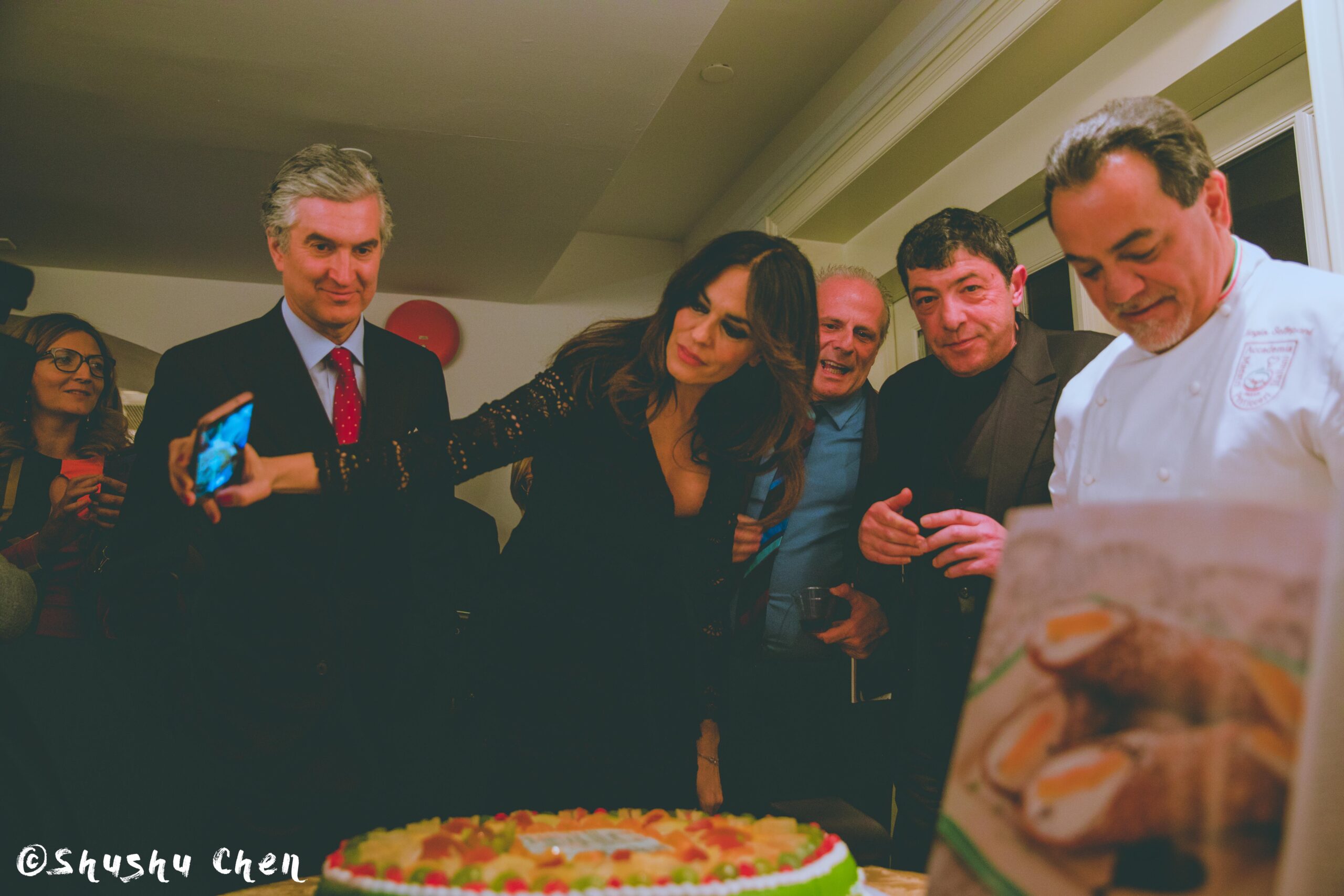 woman-taking-picture-of-the-cake-from-us-premiere-screening-i-siciliani-at-casa-italiana