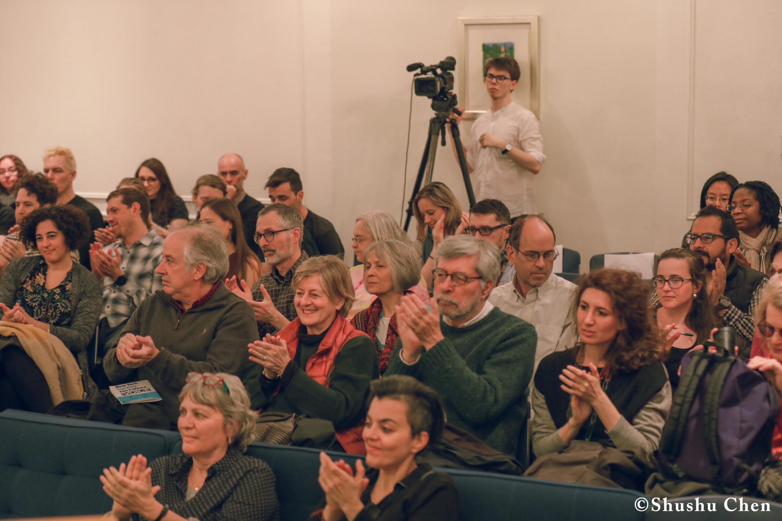 spectators-clapping-and-boy-fliming-from-pen-world-voices-literary-mews-blurring-borders-at-nyu