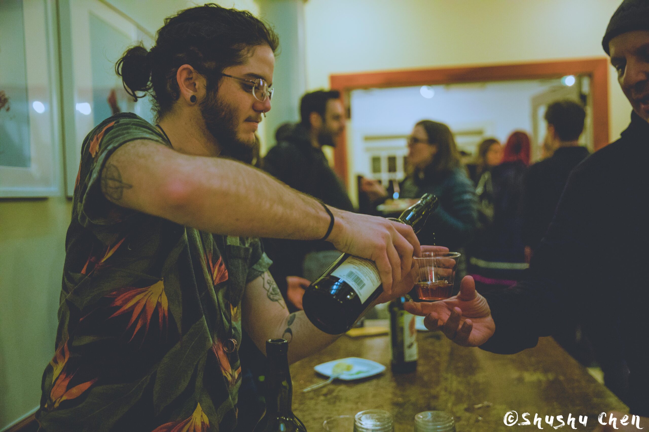 boy-serving-wine-from-us-premiere-screening-i-siciliani-at-casa-italiana