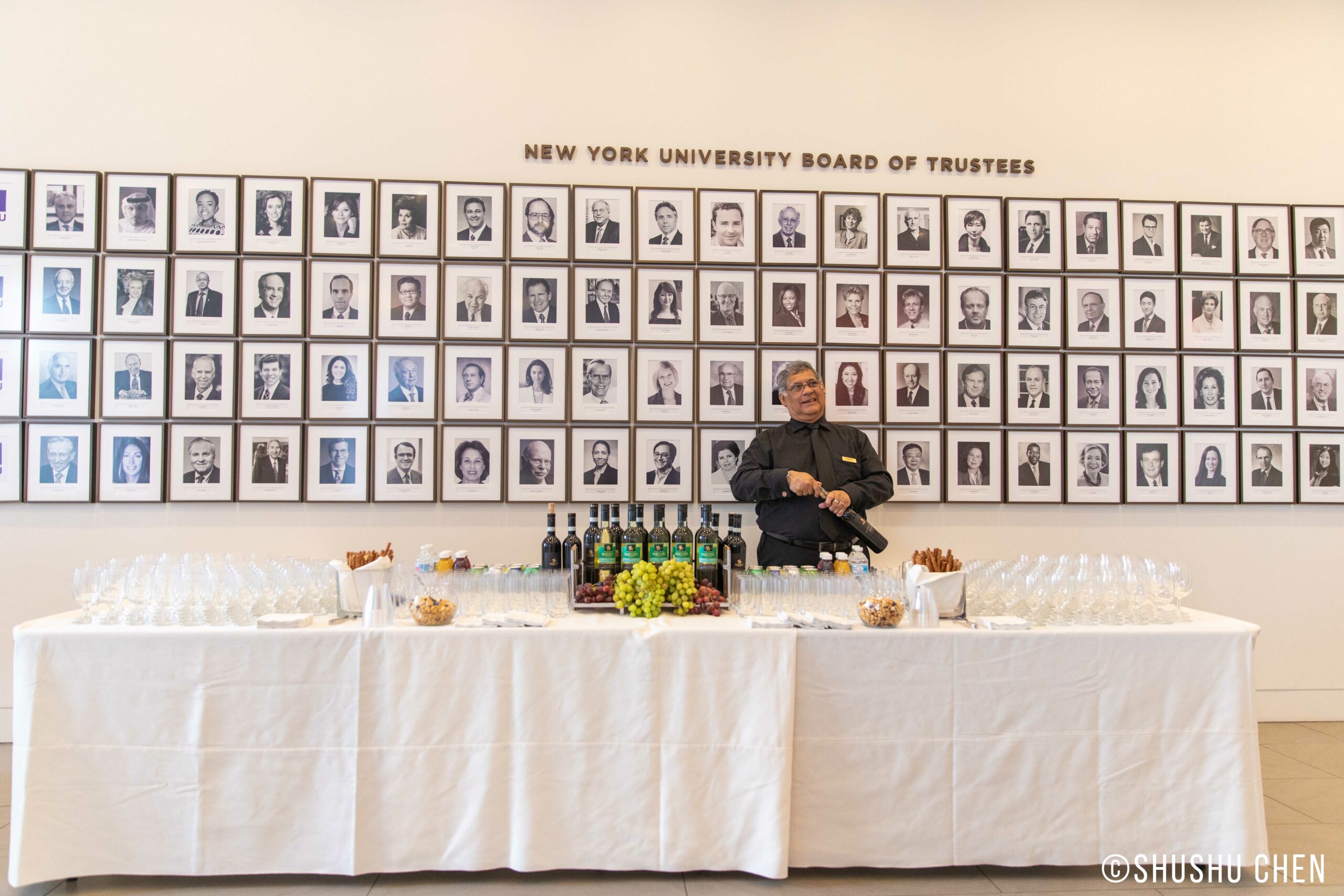 man-opening-wine-bottle-along-with-setup-of-glasses-and-wine-from-veneto-the-land-of-venice-at-nyu