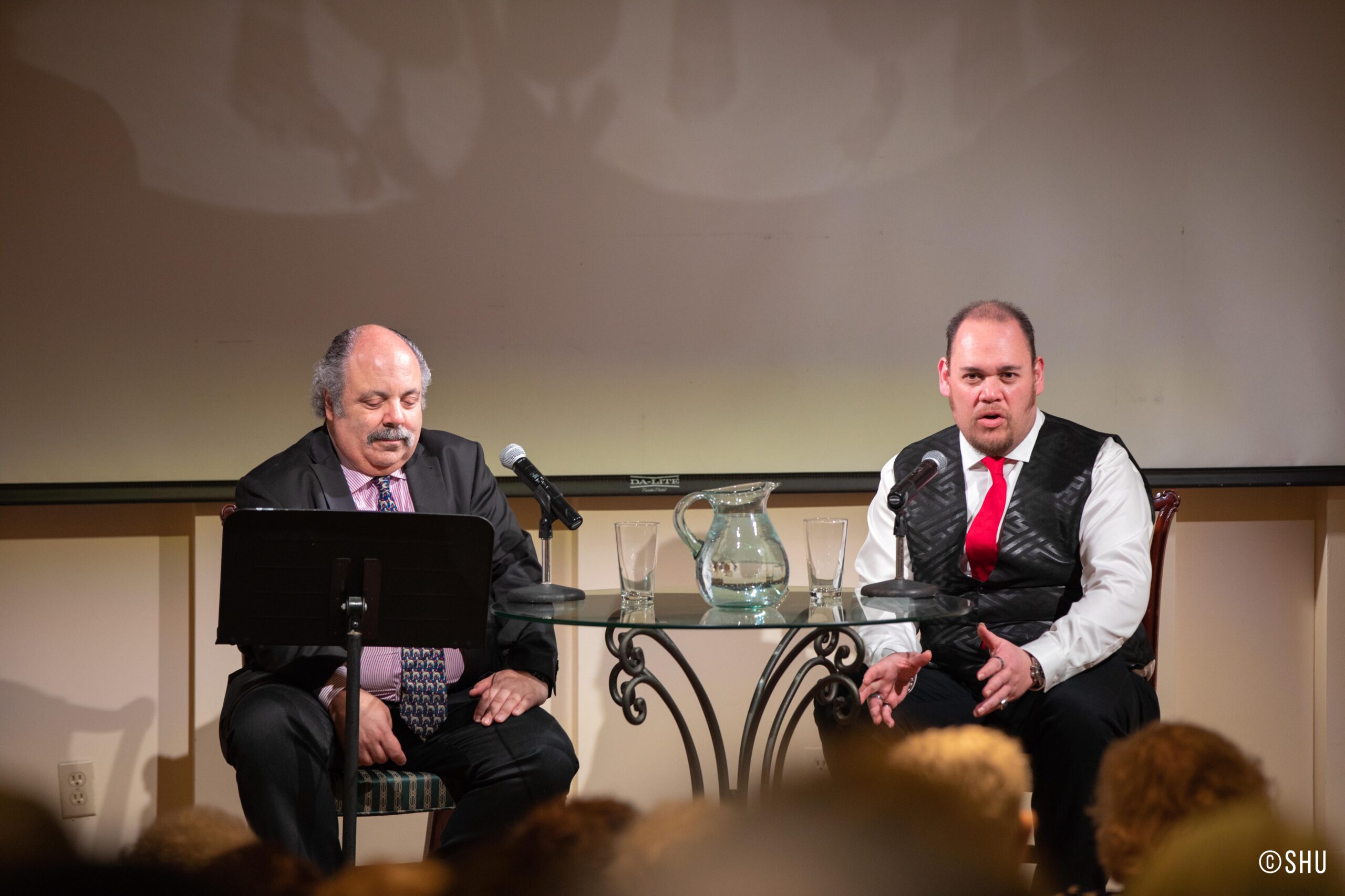 speaker-talking-from-adventures-in-italian-opera-quinn-kelsey-at-casa-italiana