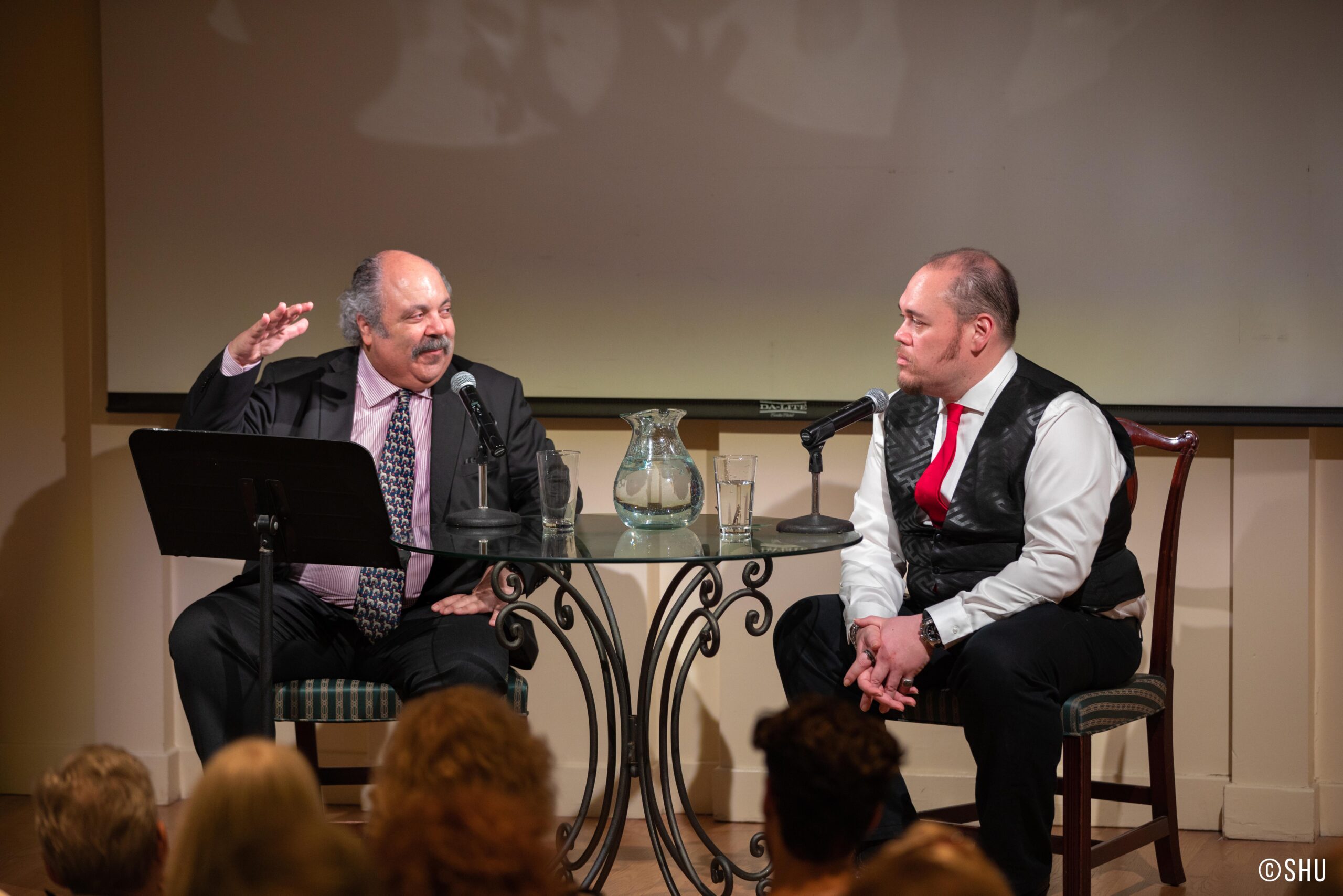 speaker-talking-from-adventures-in-italian-opera-quinn-kelsey-at-casa-italiana