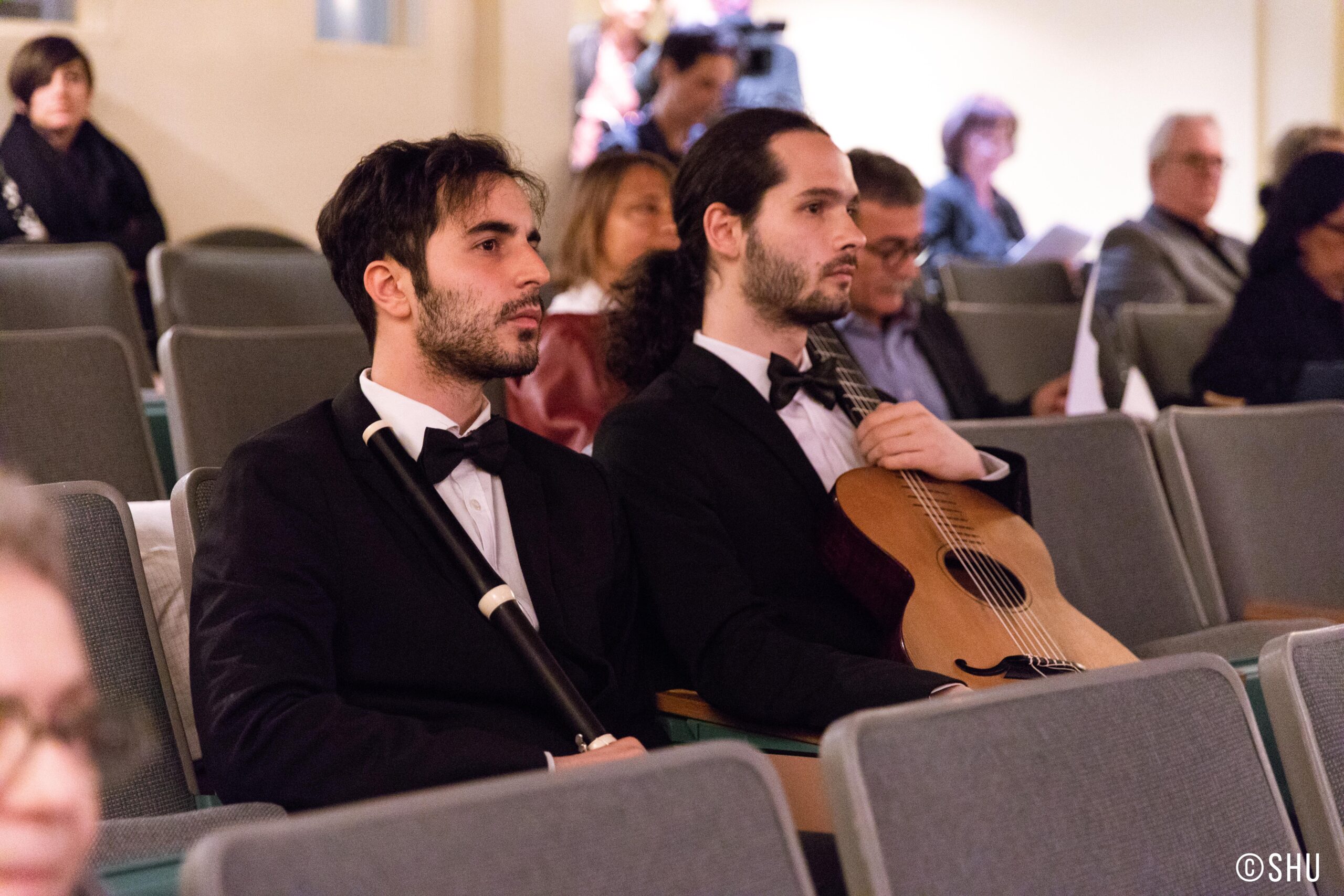musicians-seated-with-guitar-and-flute-from-concert-ibla-foundation-winners-at-casa-italiana