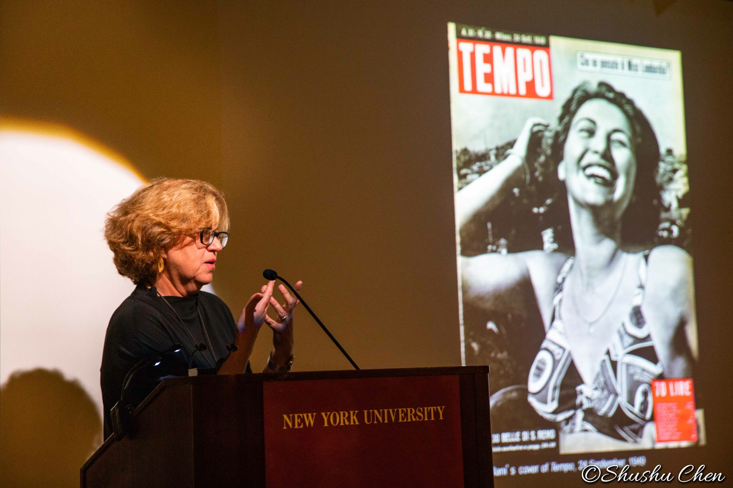 speaker-talking-and-image-being-displayed-on-projector-screen-from-neorealism-and-photography-at-casa-italiana