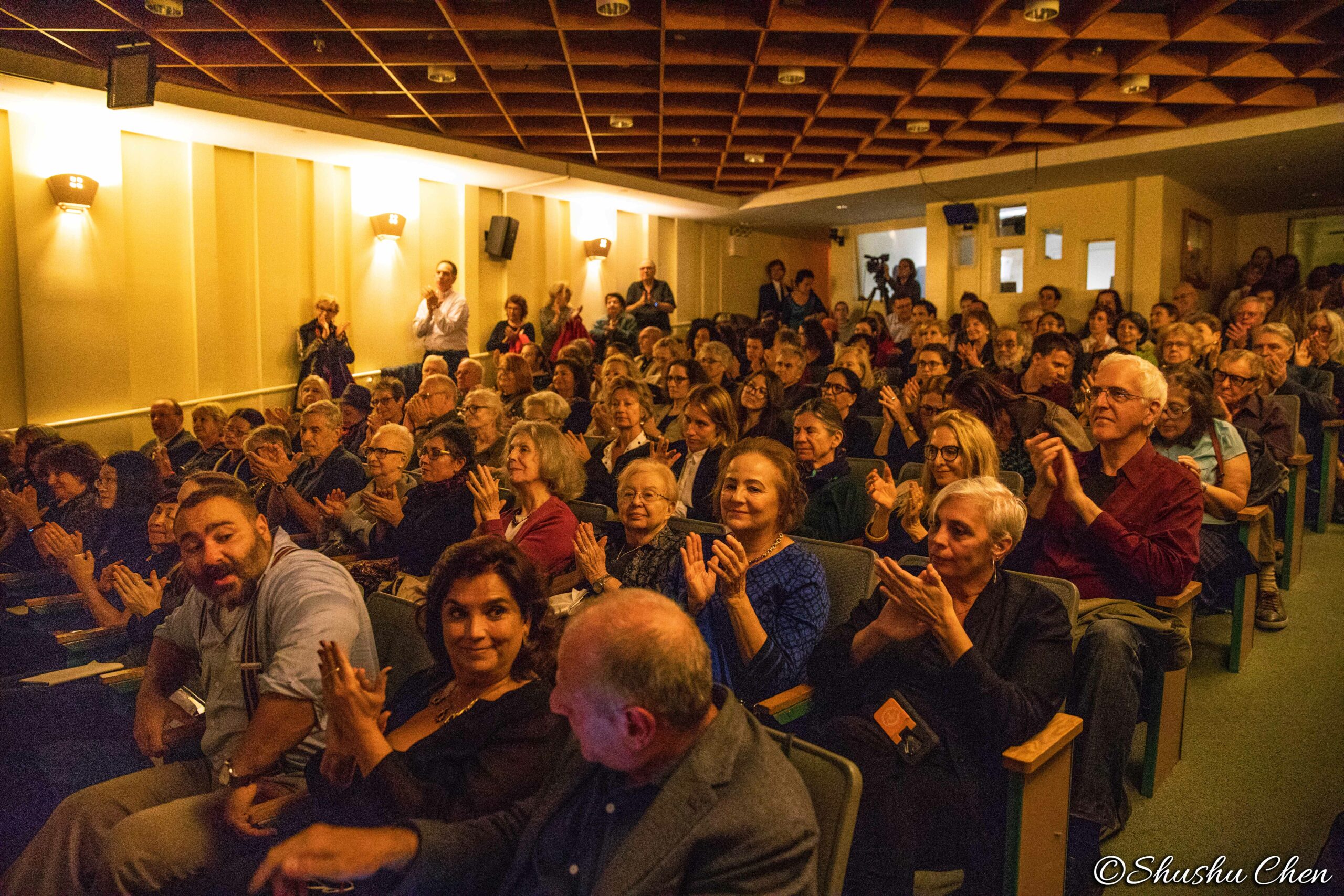 spectators-clapping-from-neorealism-and-photography-at-casa-italiana