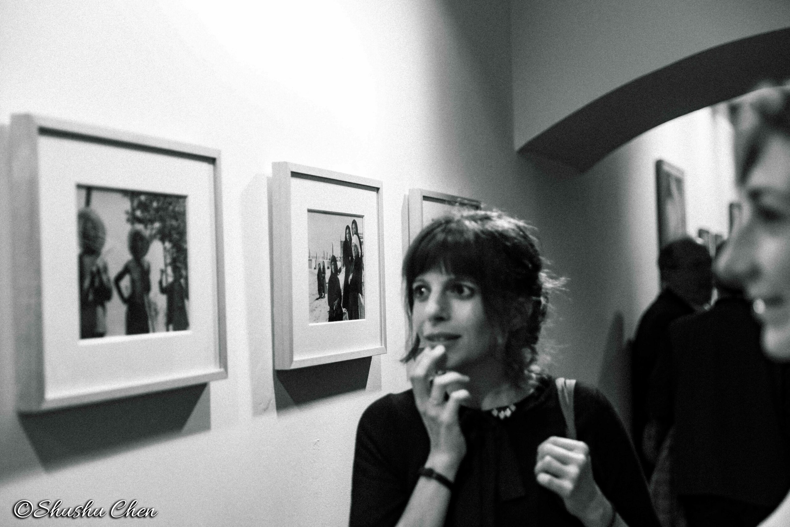 guest-interacting-and-artwork-on-wall-from-neorealism-and-photography-at-casa-italiana