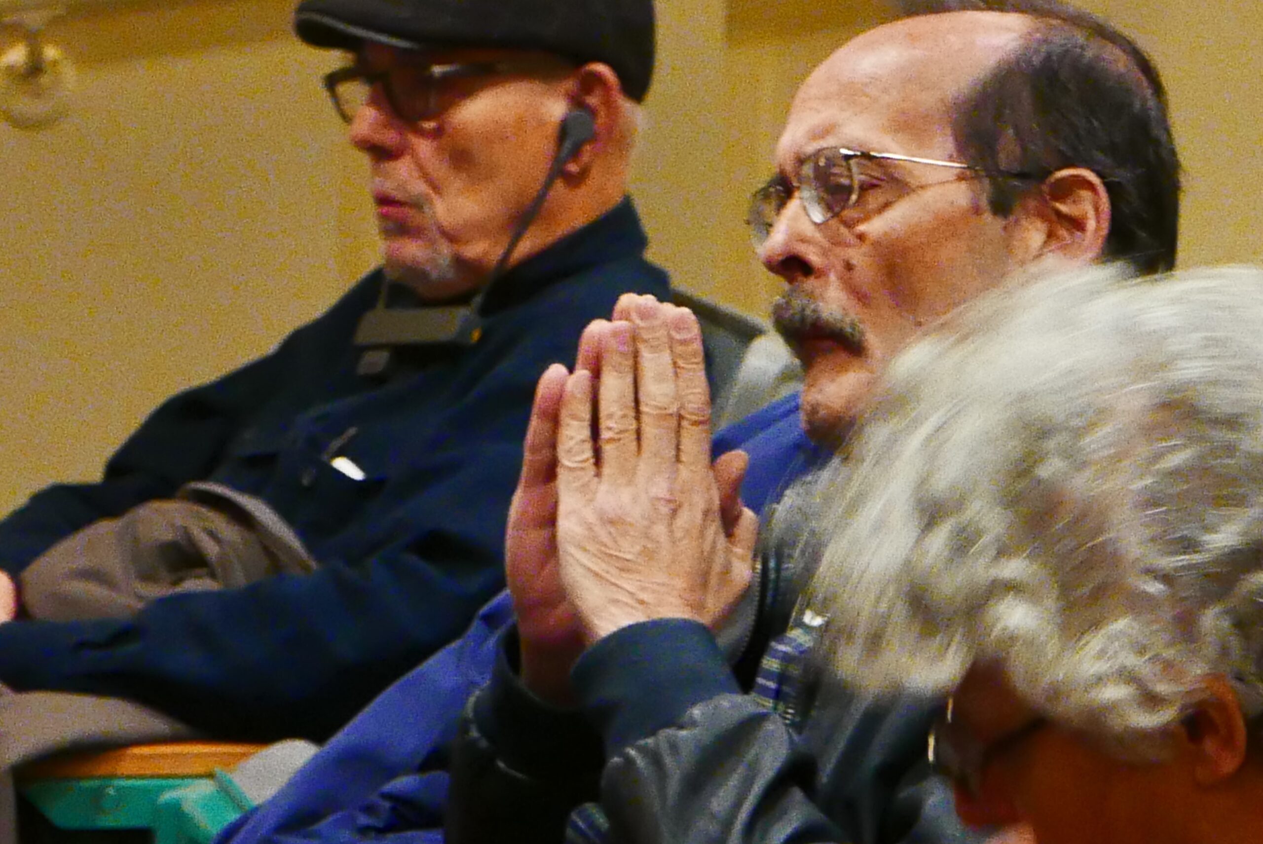 spectator-seated-with-joined-hands-from-when-the-american-press-flirted-with-fascism-at-casa-italiana