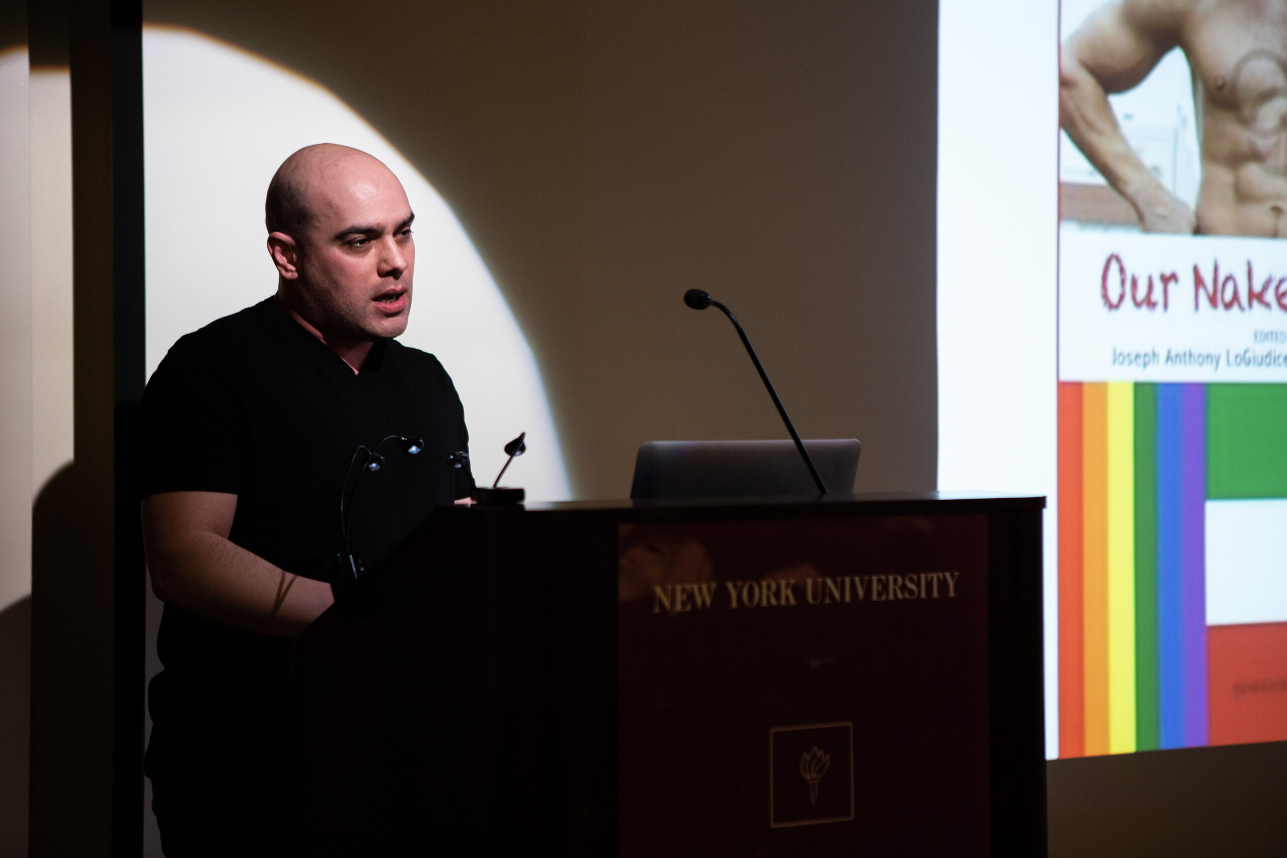 speaker-talking-and-image-being-displayed-on-the-projector-screen-from-lgbtq-in-italian-american-theater-at-casa-italiana