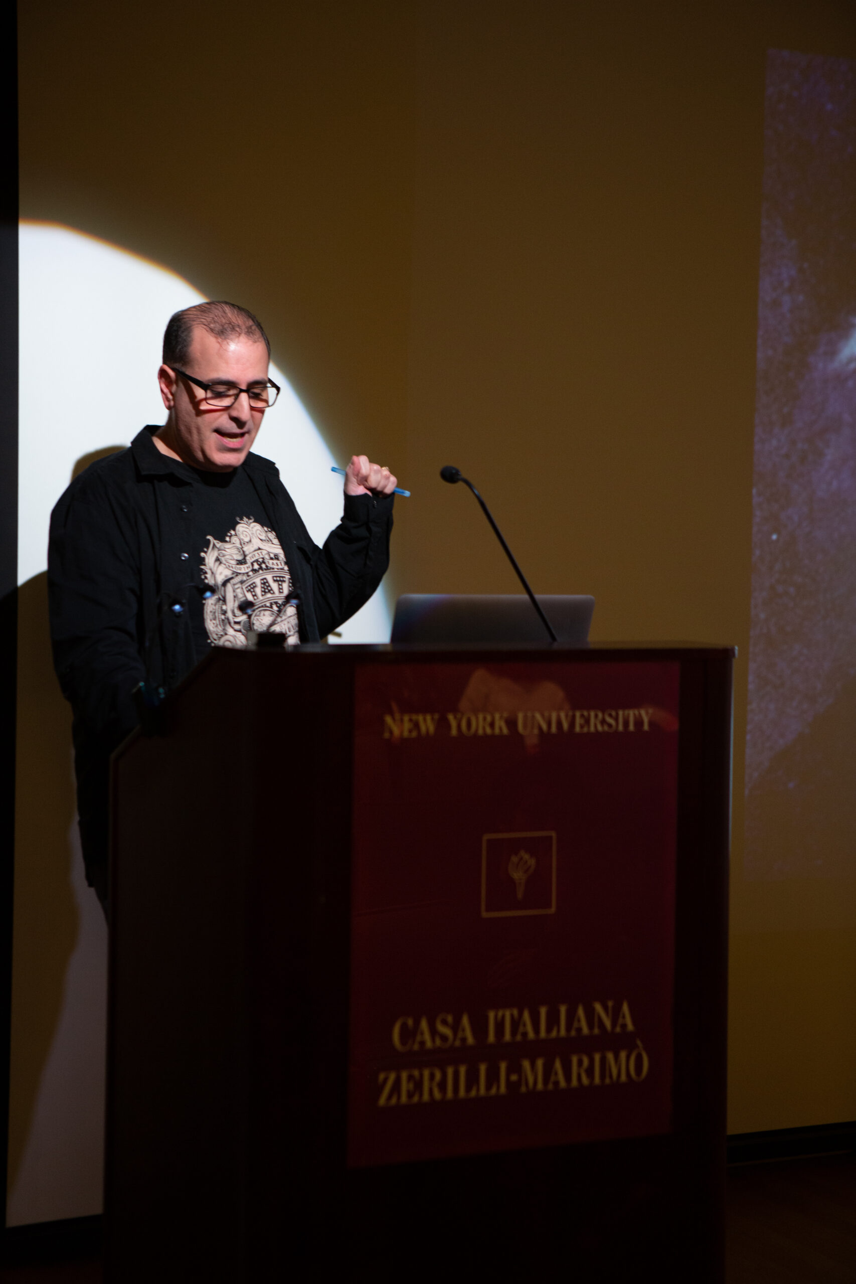 speaker-talking-from-lgbtq-in-italian-american-theater-at-casa-italiana
