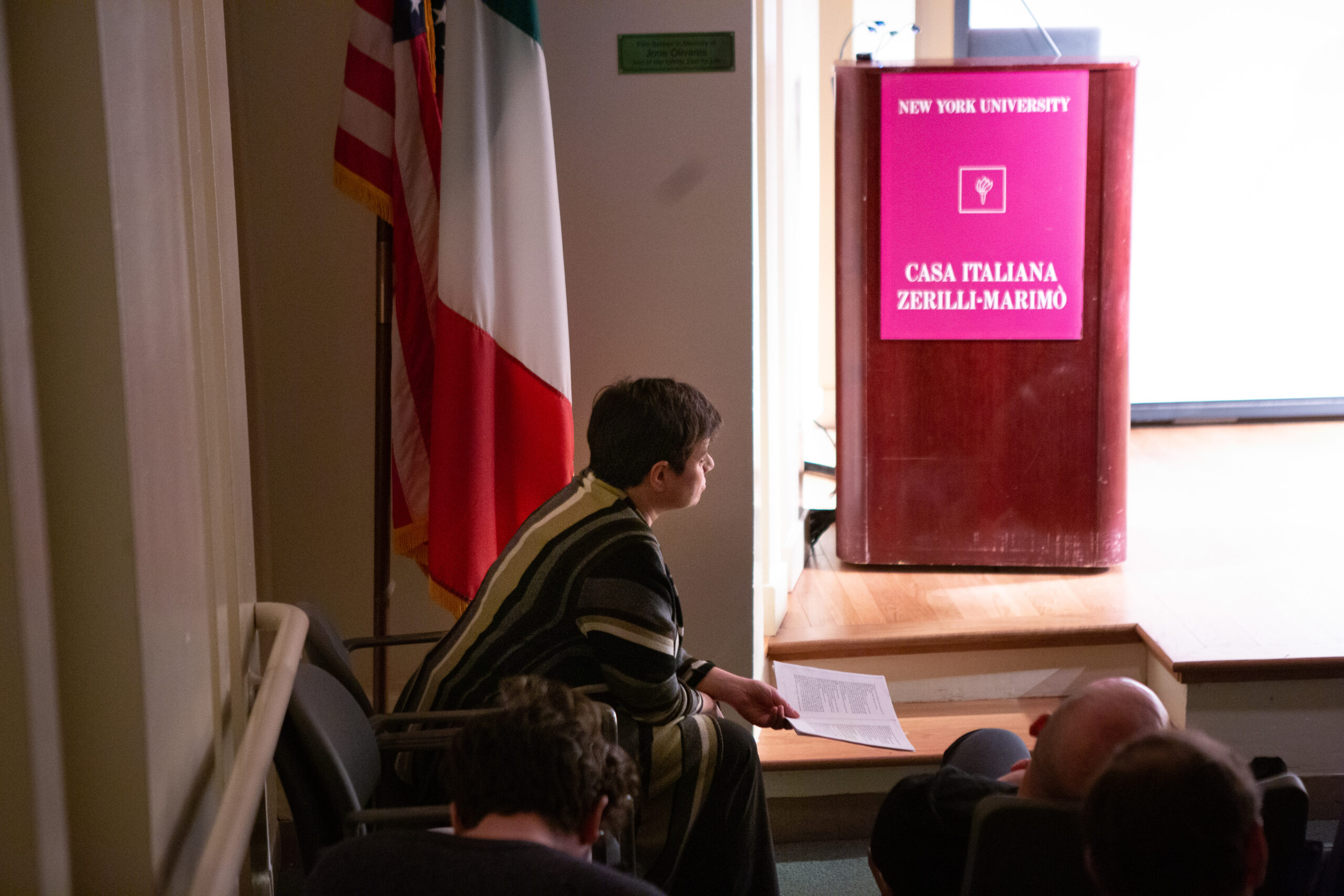 speaker-seated-from-lgbtq-in-italian-american-theater-at-casa-italiana