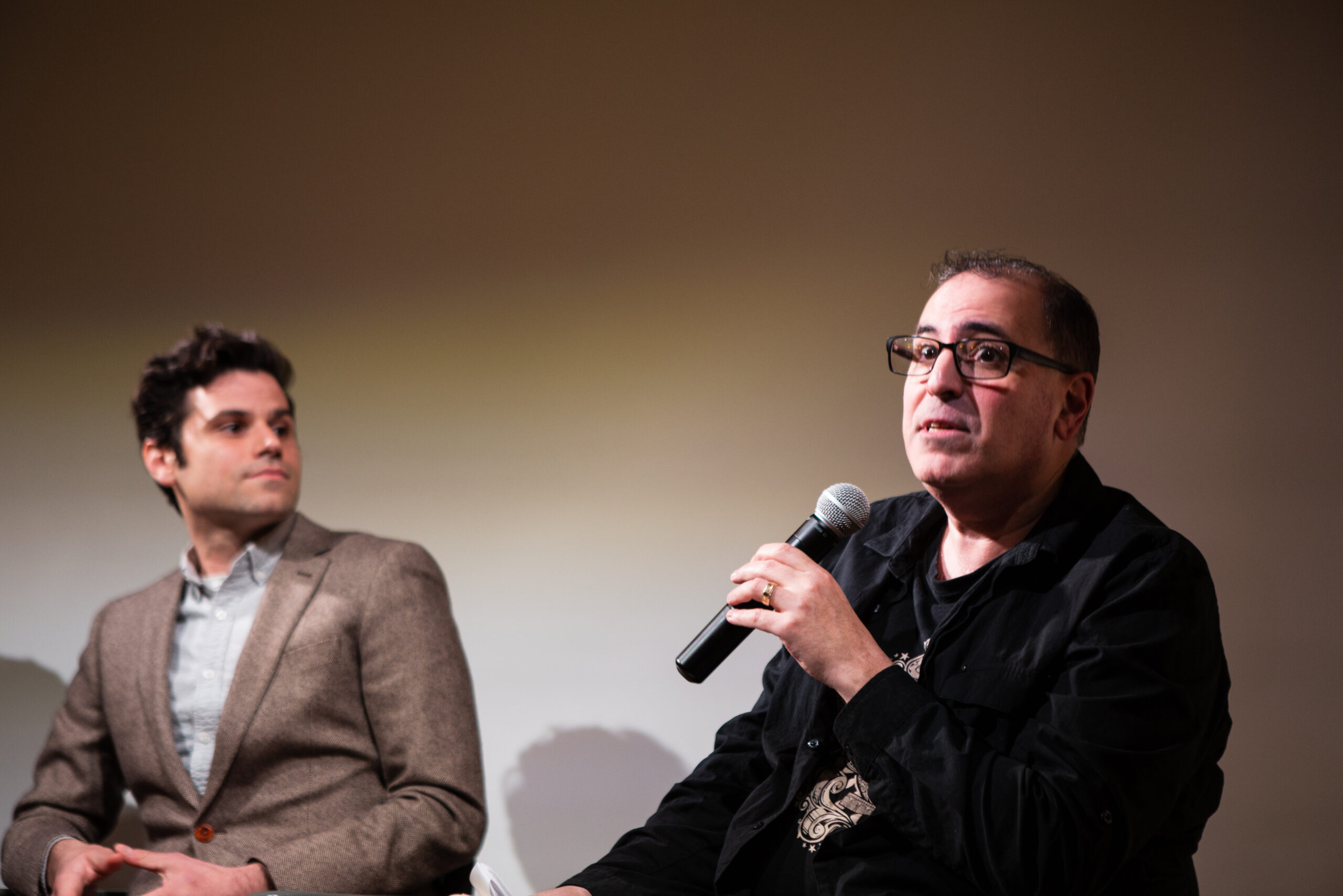 speaker-talking-from-lgbtq-in-italian-american-theater-at-casa-italiana